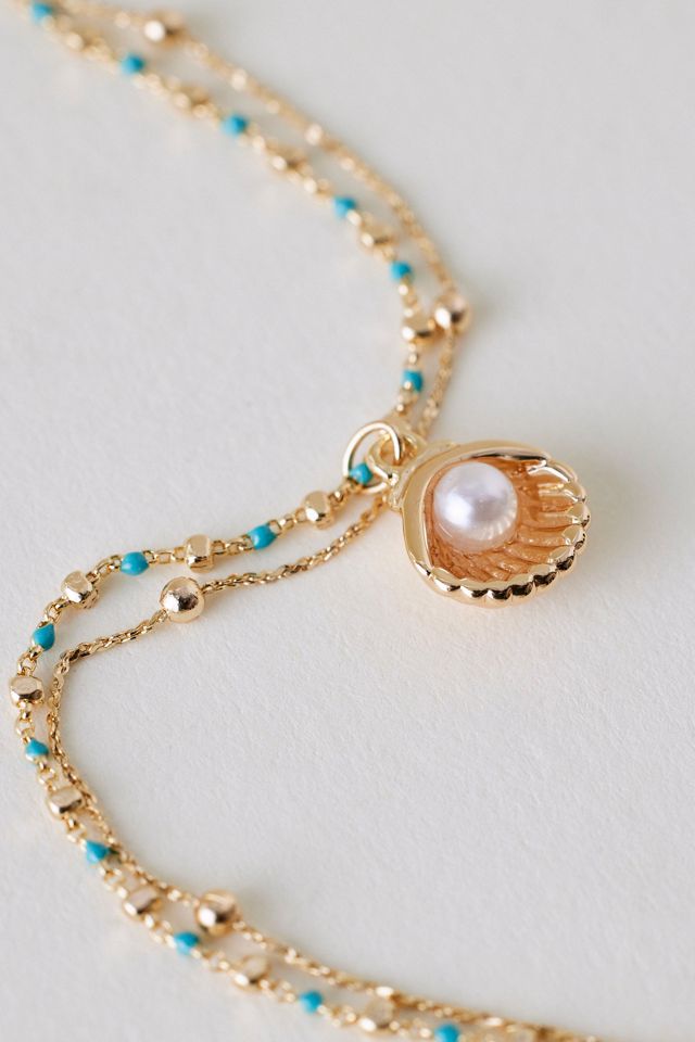 Pulsera con Dije de Concha Bañada en Oro #1