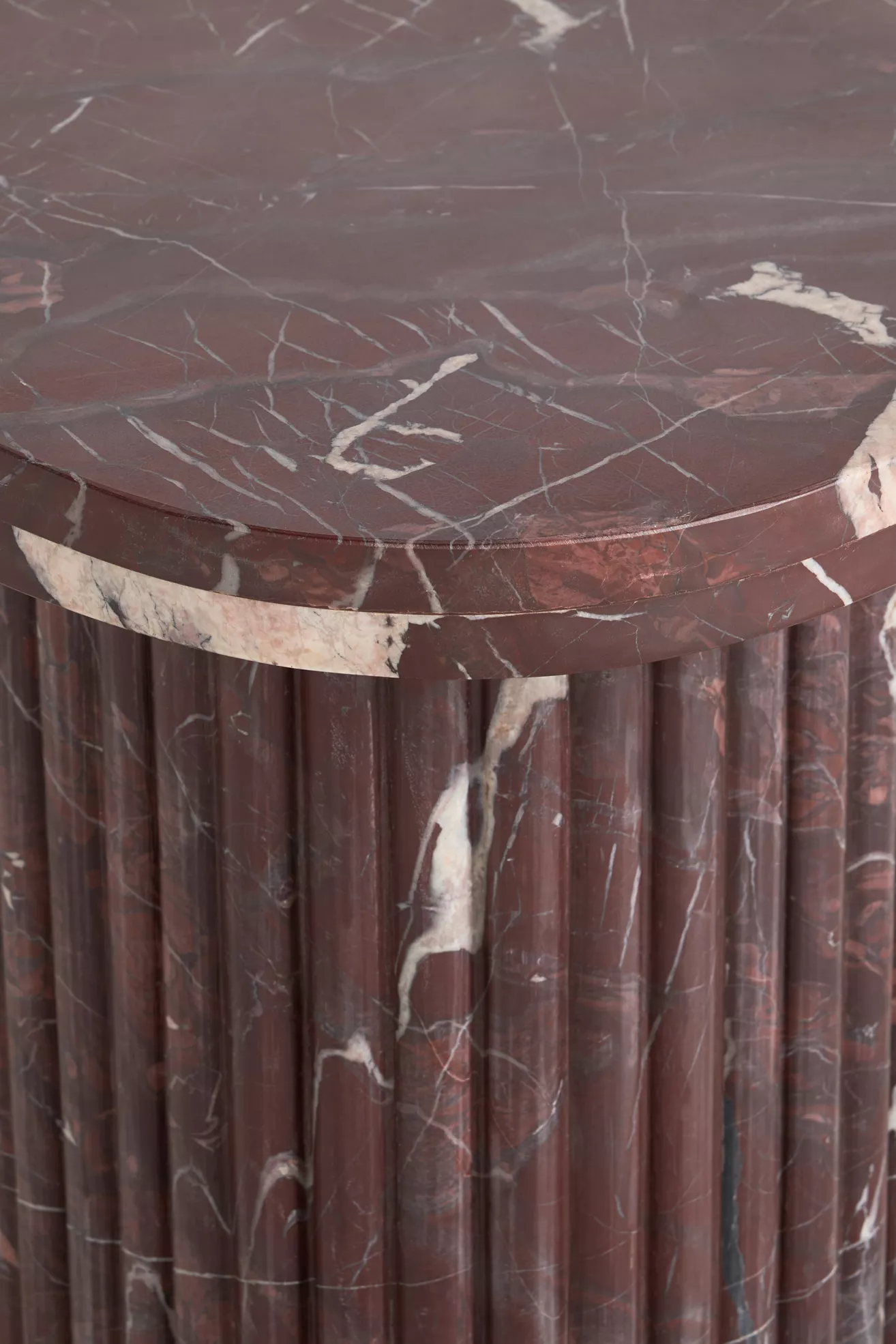 Close-up of marble veining and edge on Kanta side table surface