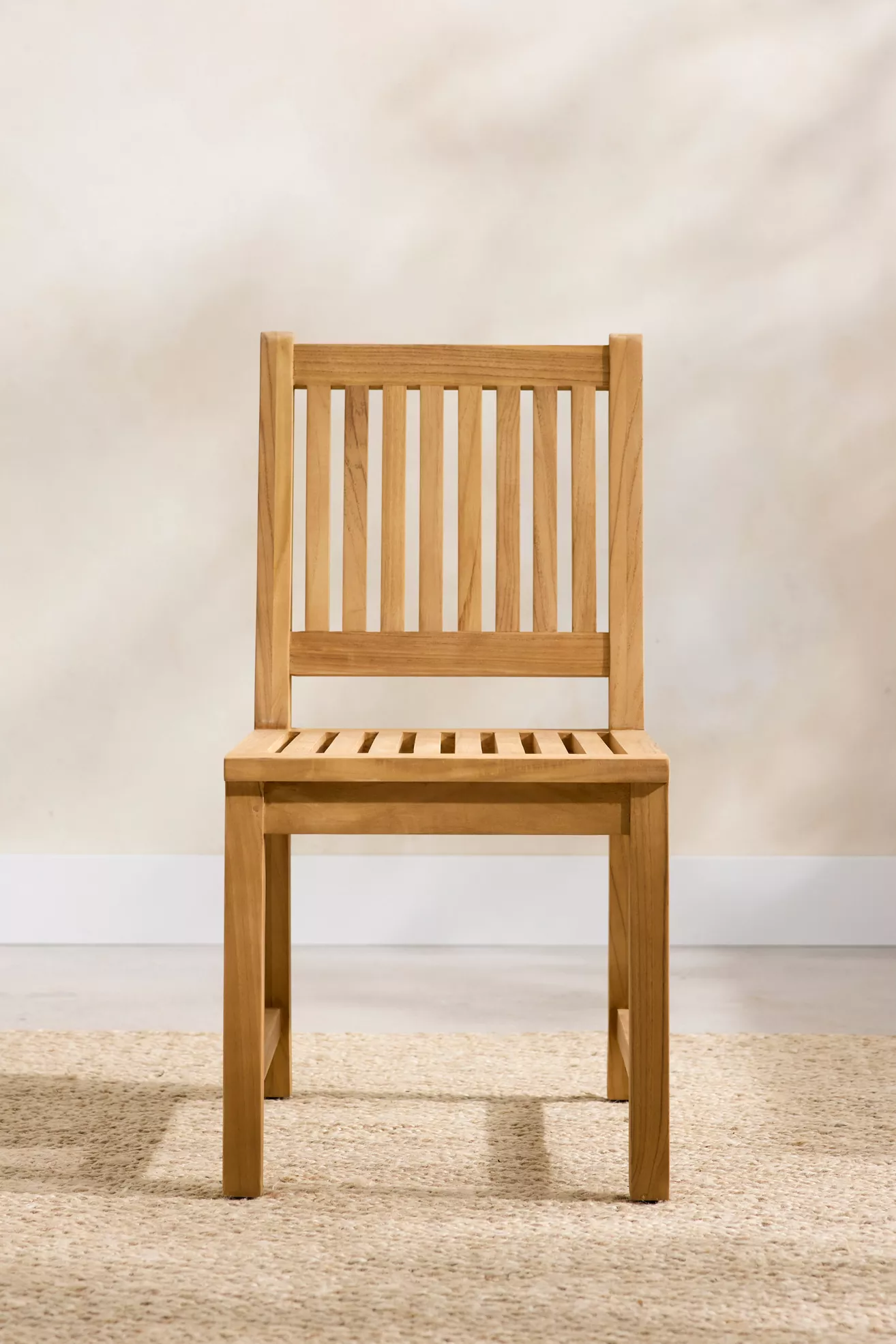 Front perspective of teak chair