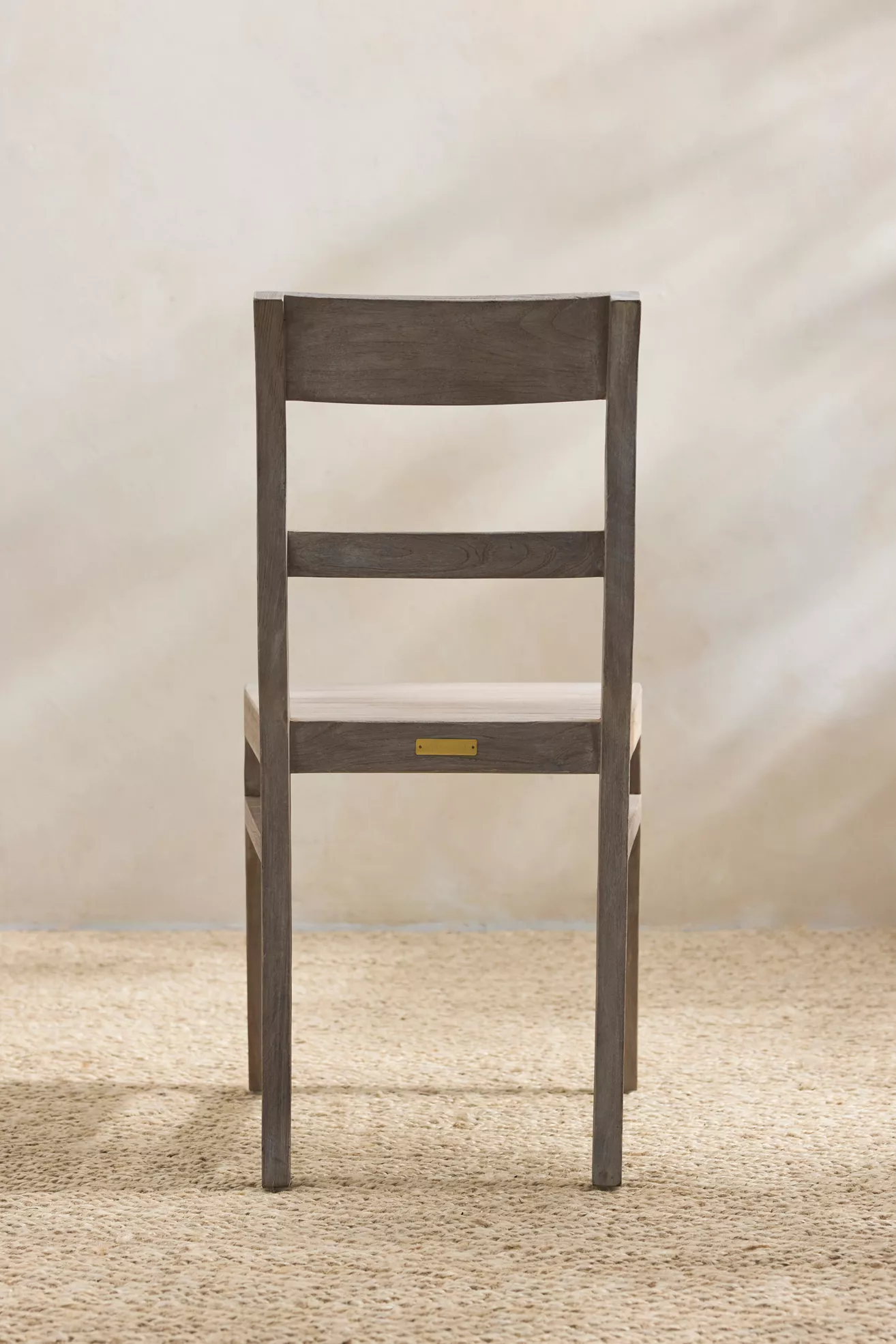 Back view of Noni chair showing backrest and legs
