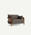 Heatherfield chair in gray upholstery with woven cane arms and wood legs