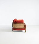 Heatherfield chair back three-quarter view with coral-red cushions