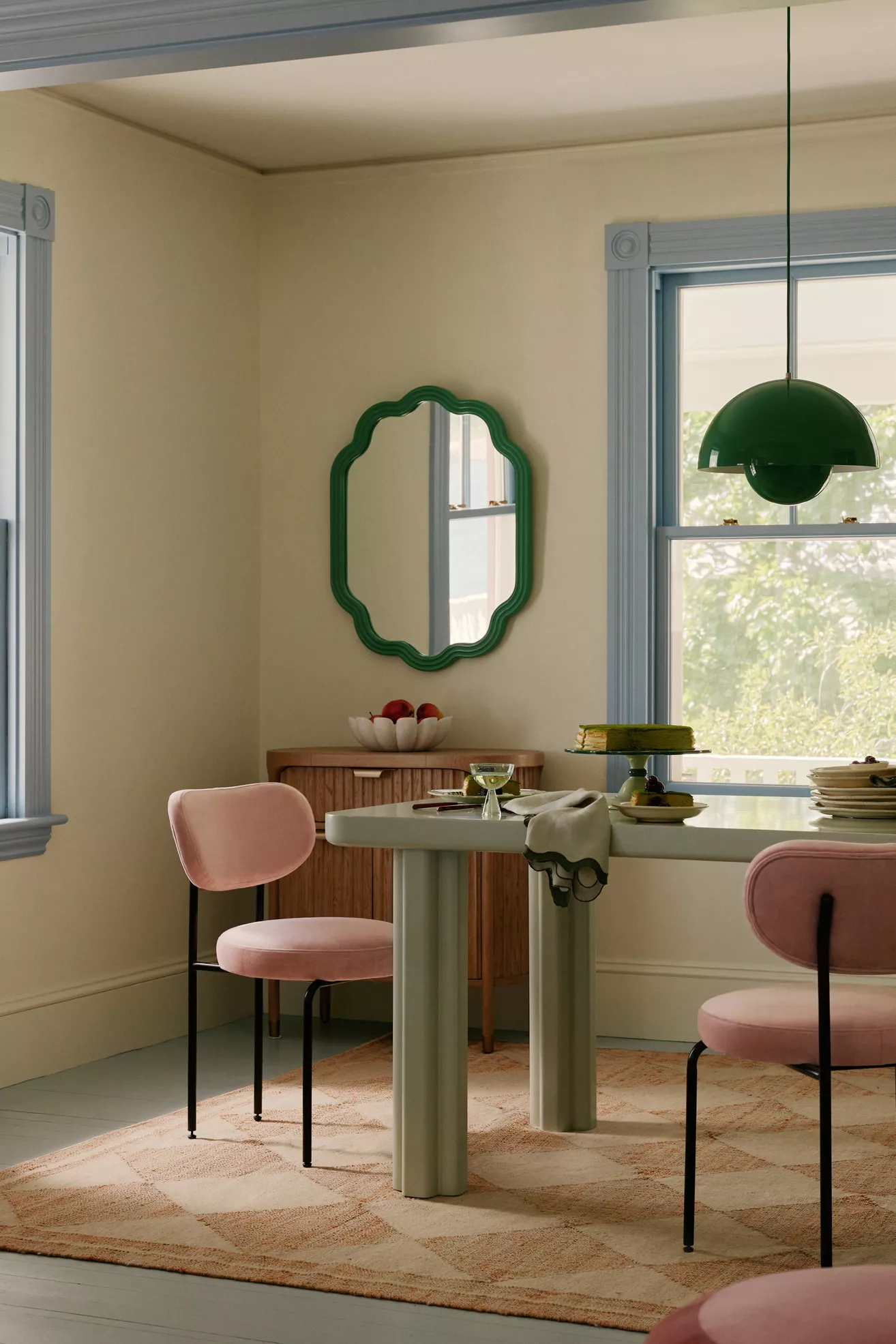 Dining room scene with table and pink chairs