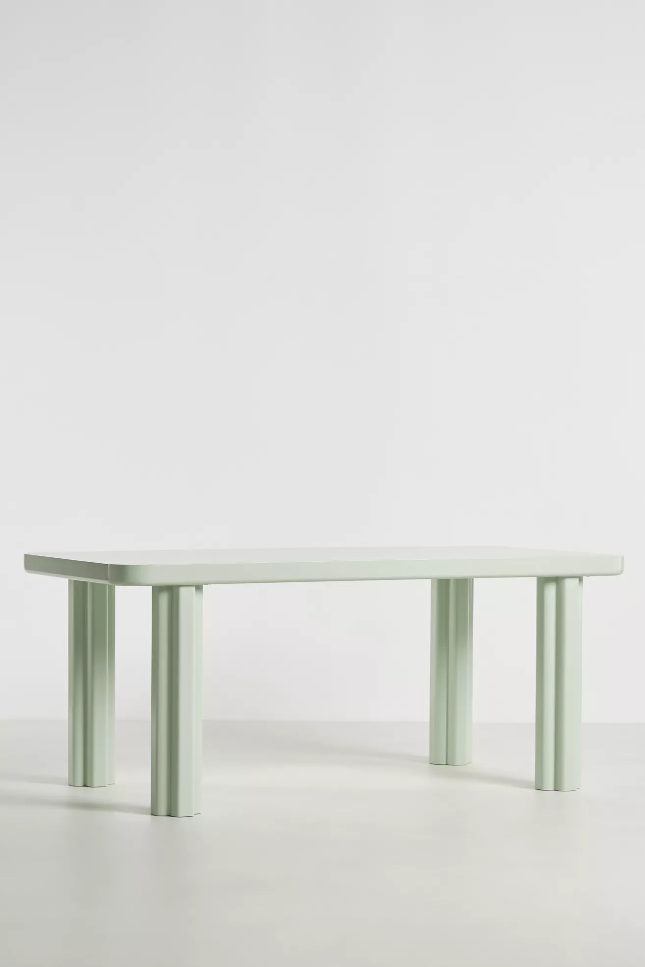 Front/longitudinal view of pale green dining table