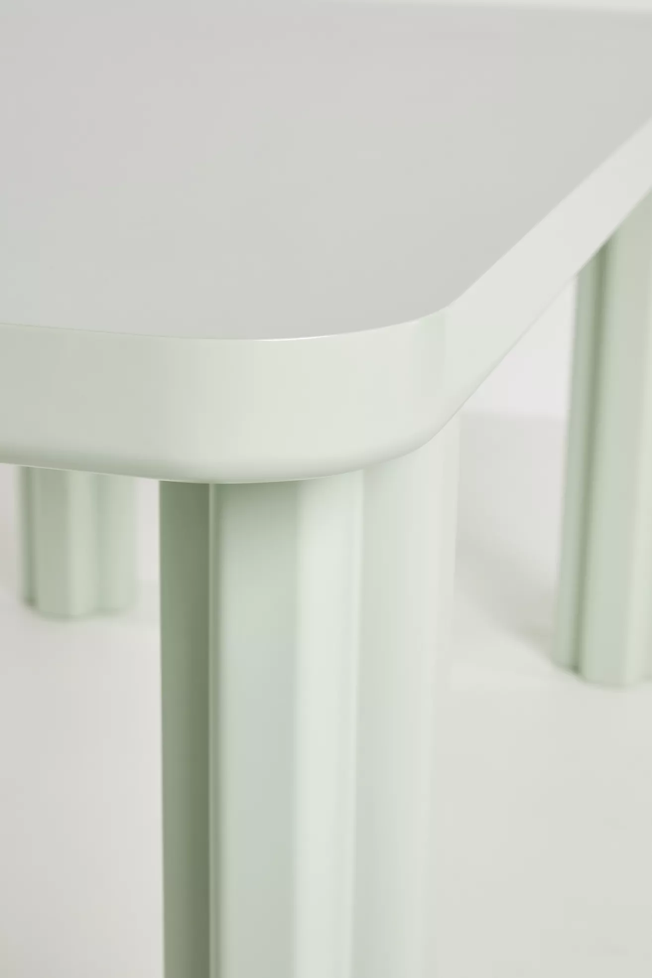 Close-up of table edge and leg junction