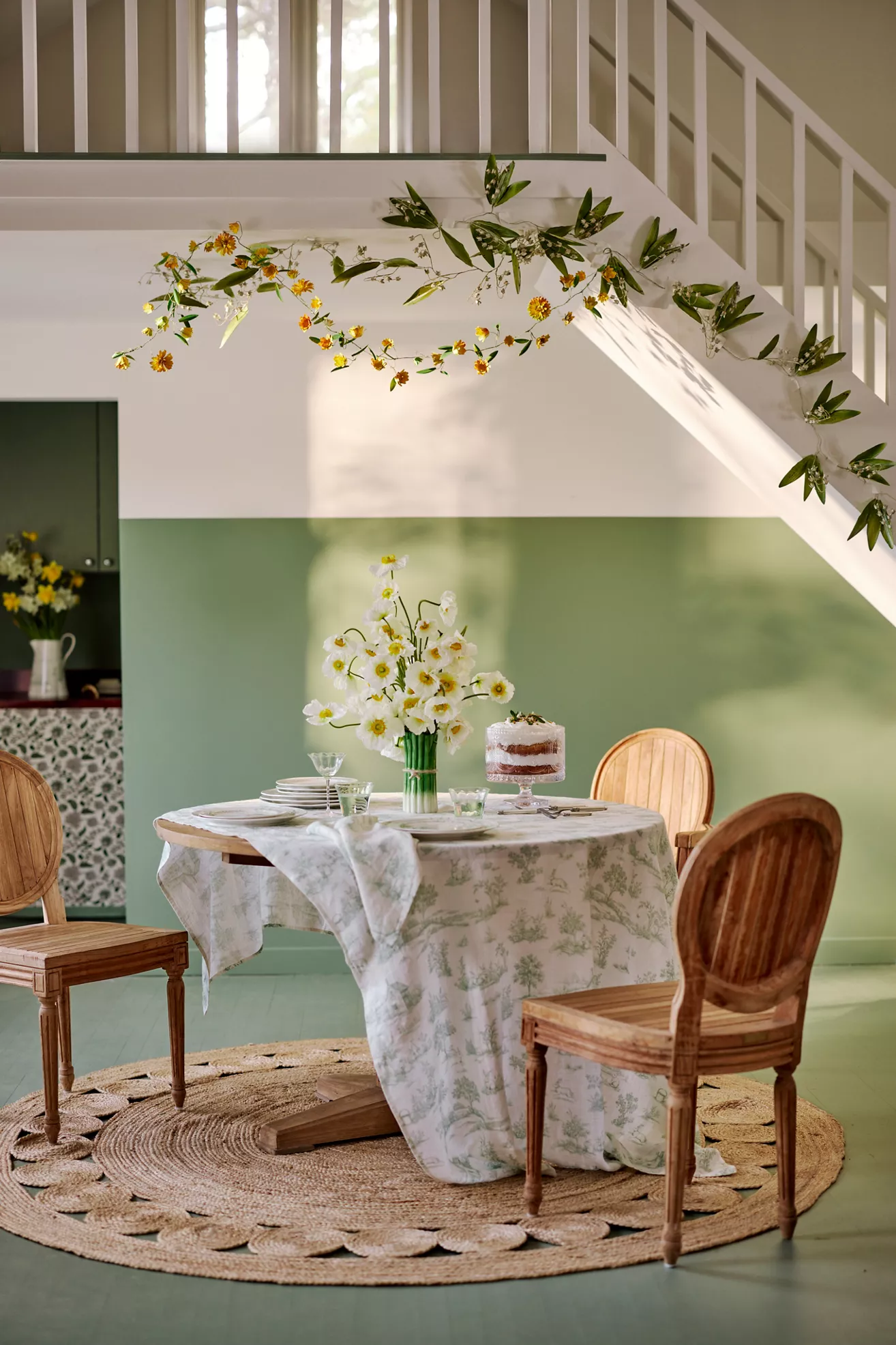 Dining table set with chairs in a bright green room