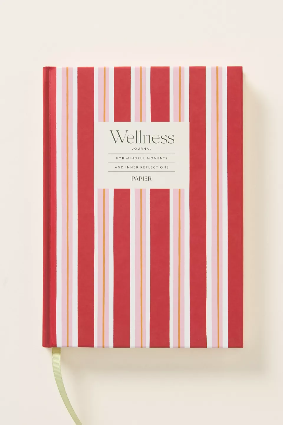 A pink and red striped journal