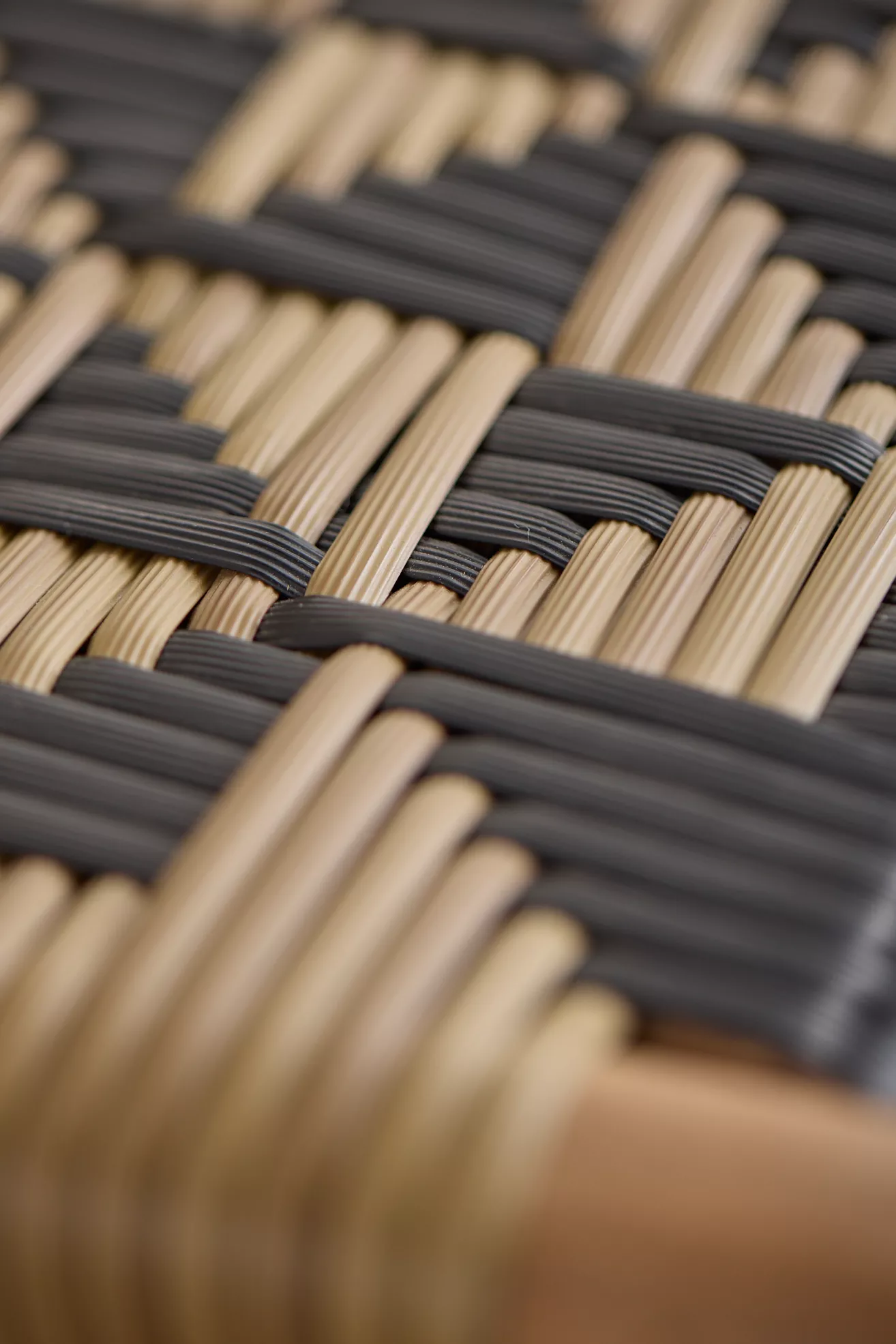 Close-up of the chair weaving with tan and dark stripes