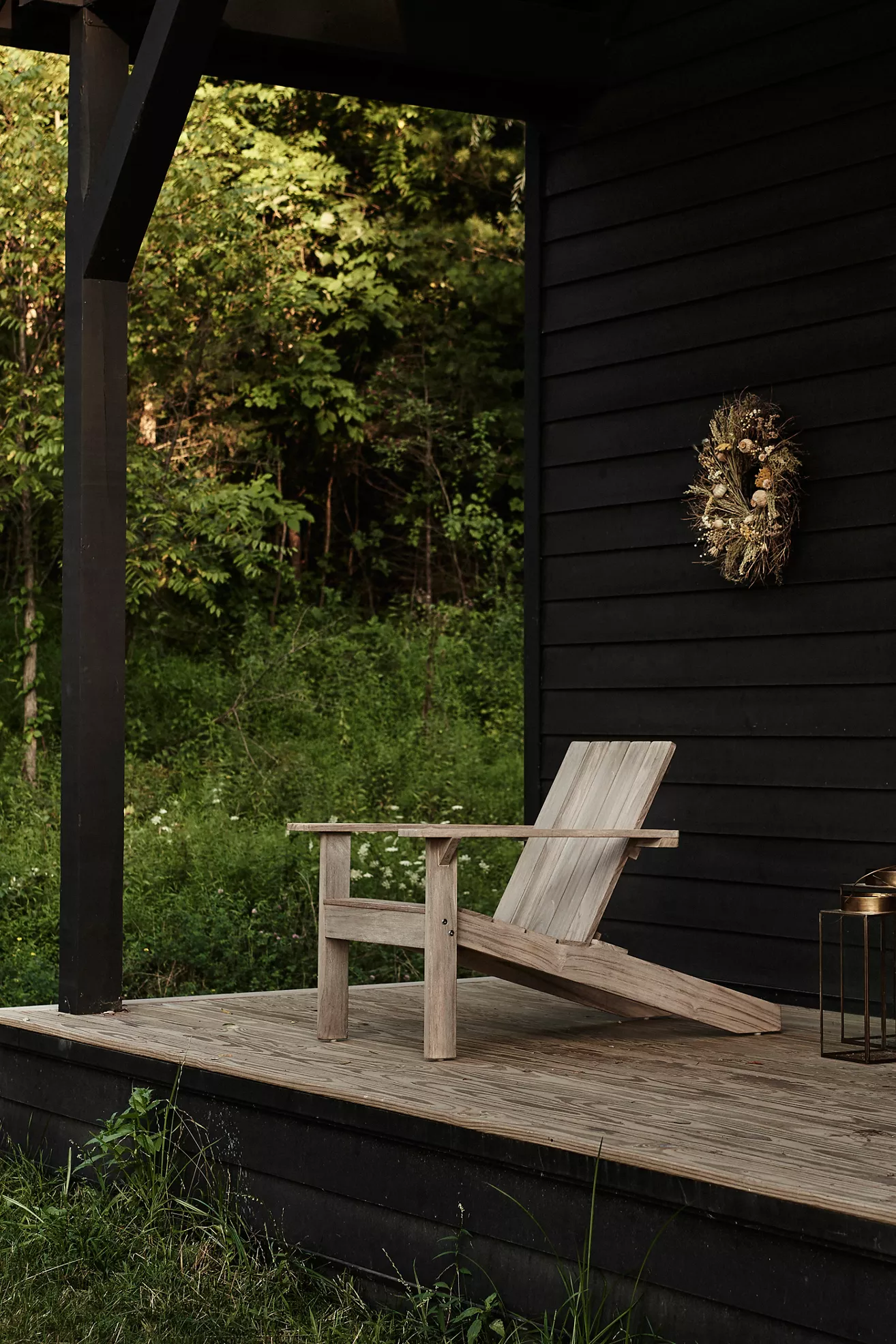 Teak Adirondack chair on porch