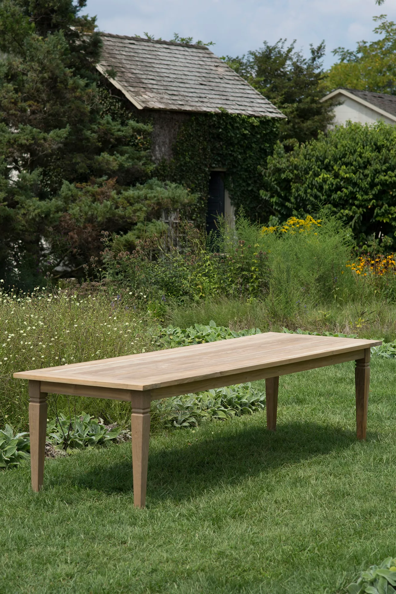 Wood dining table outdoors in garden