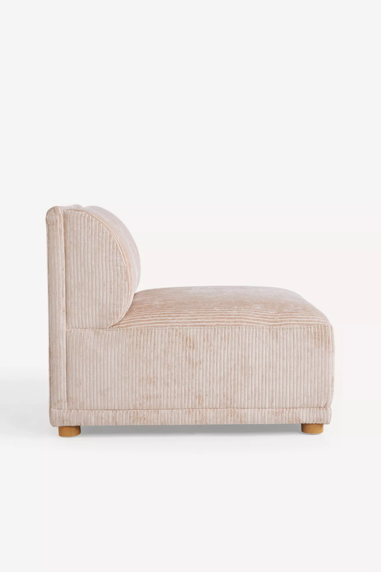 Profile view of armless chair with rounded back and base