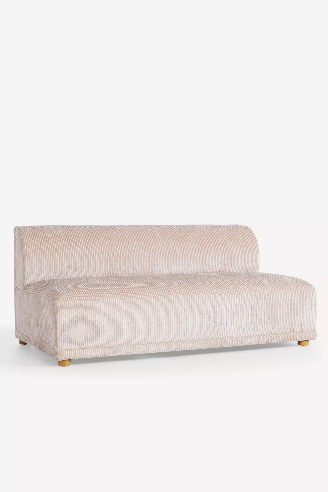 Side view of sofa with corduroy fabric and wooden legs.