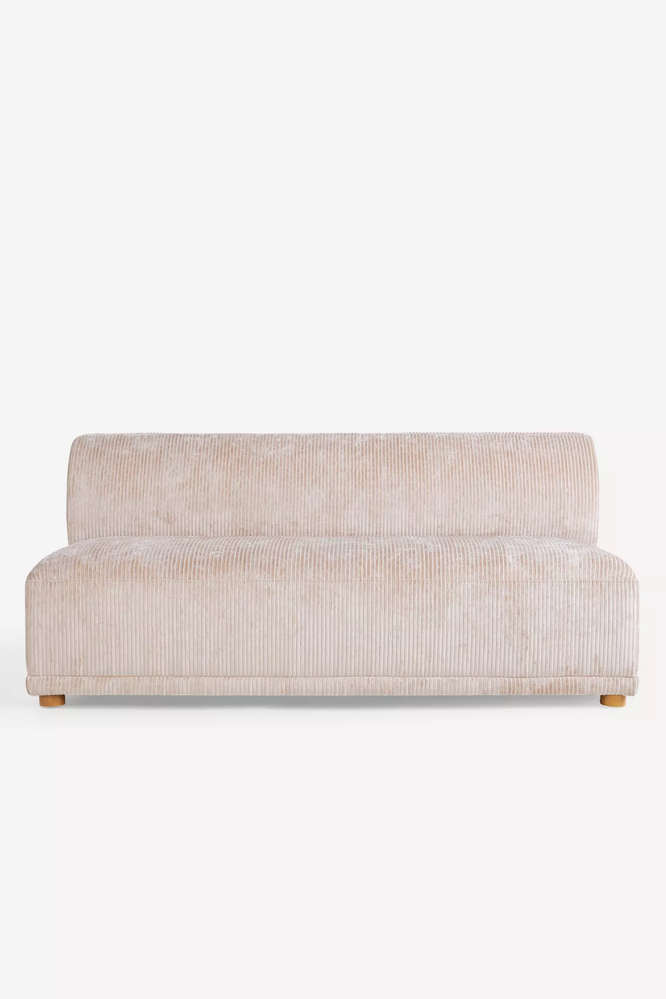 Close-up of beige corduroy fabric upholstery on the sofa.