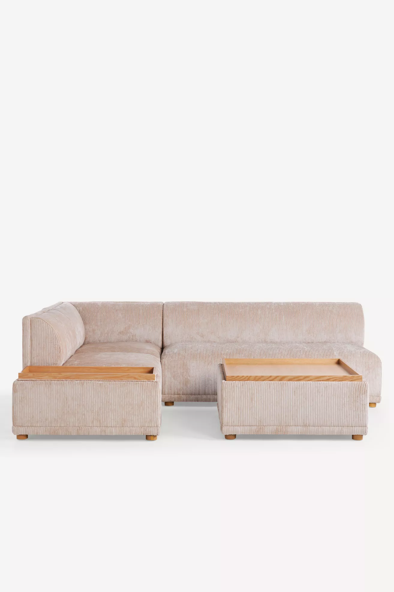 Light beige corduroy modular corner chair section with attached ottoman pieces.