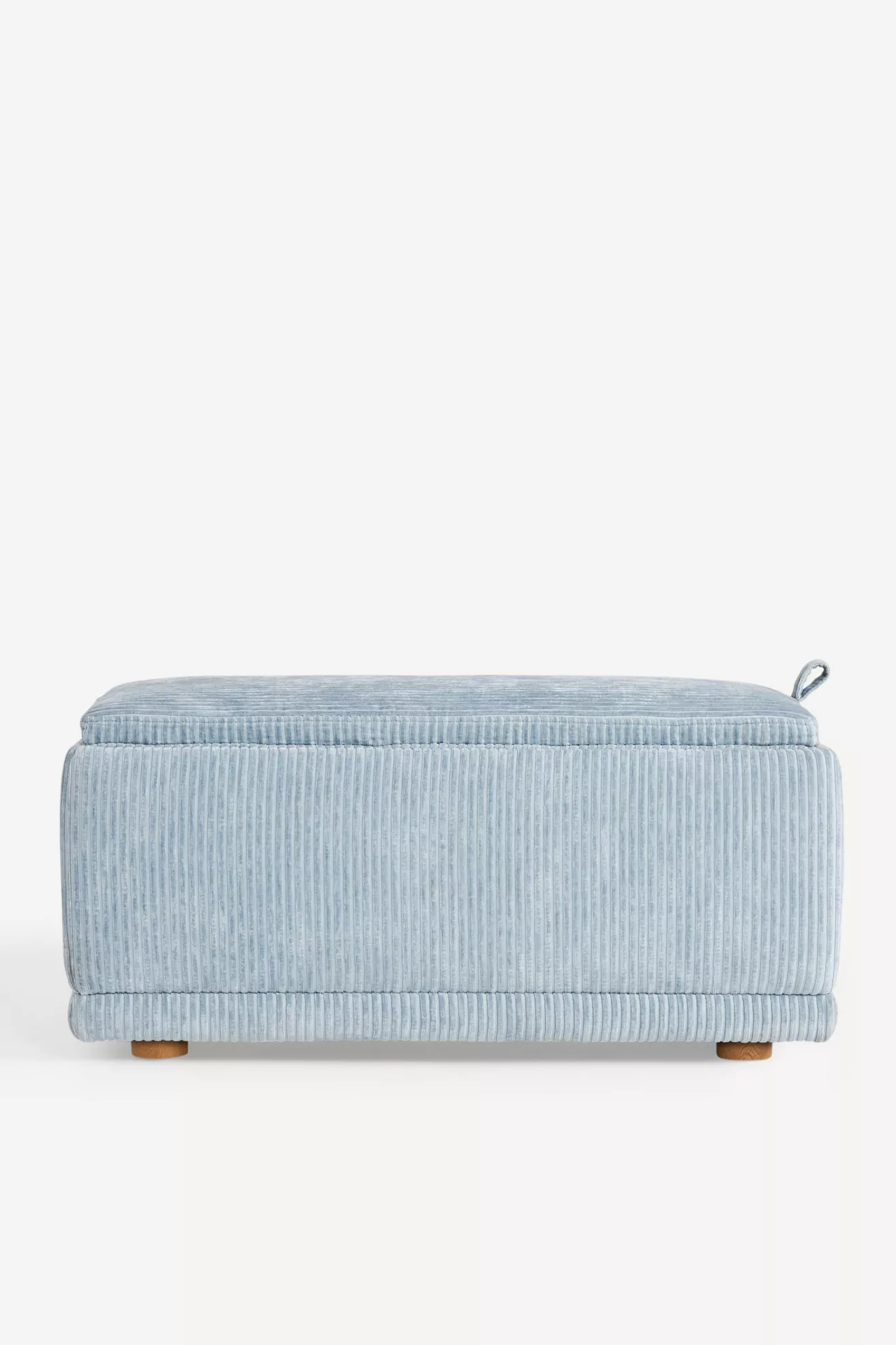 Front-right side view of light blue corduroy storage ottoman with lid closed.