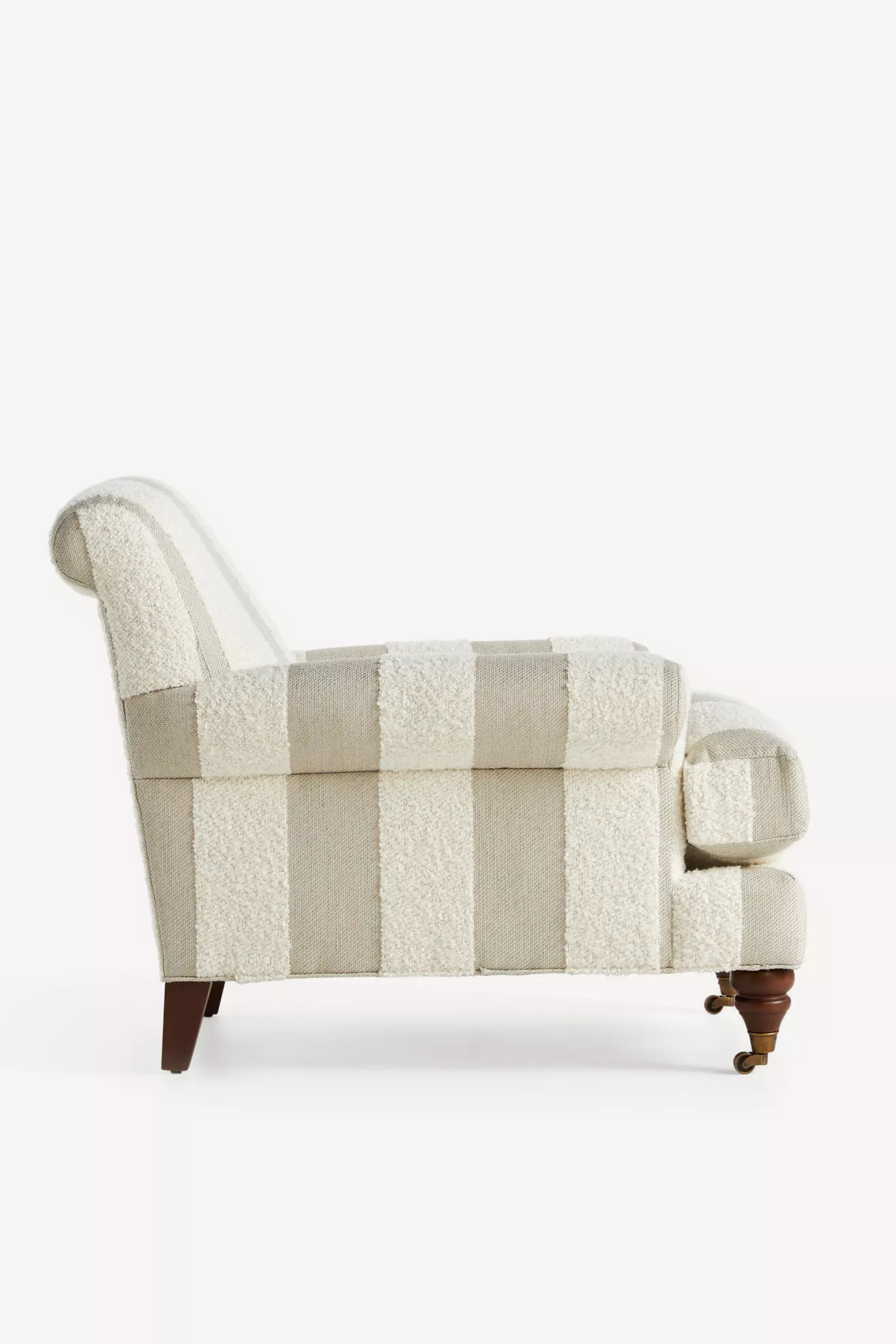 Striped bouclé chaise-style armchair with rounded back and tufted cushions