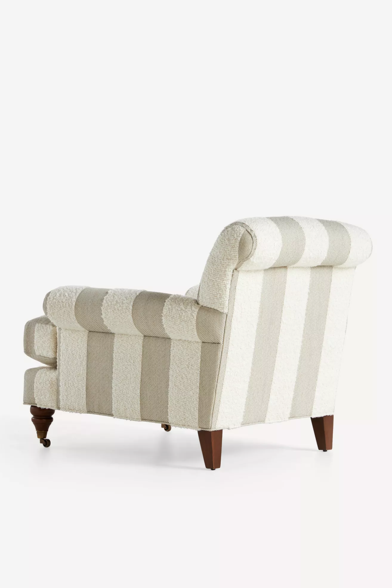 Striped bouclé armchair with curved headrest and button-tufted back