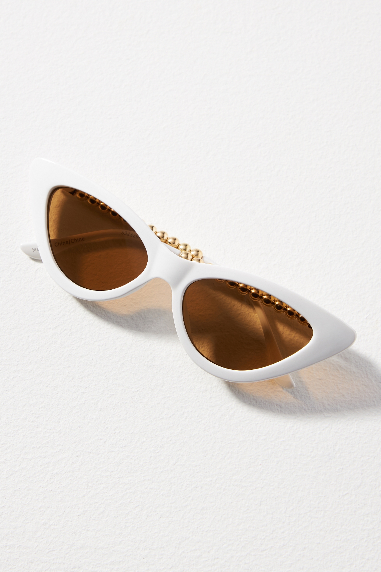 Anthropologie Dark Green Slim Oval Cat Eye Sunglasses with Gold Knotted Arms Eyeking Slim Tiny Oval Sunglasses at MarketFair Shoppes in  main image 2