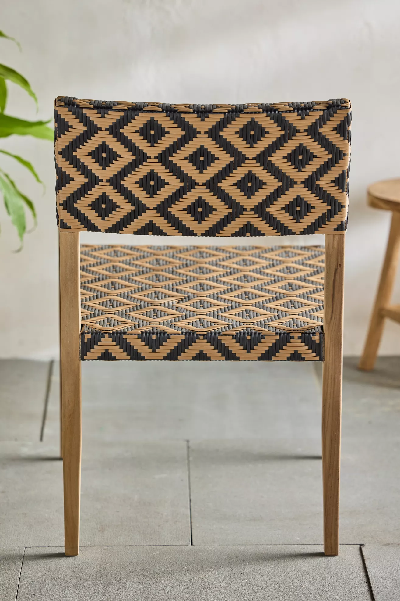 Rear view of chair highlighting woven backrest