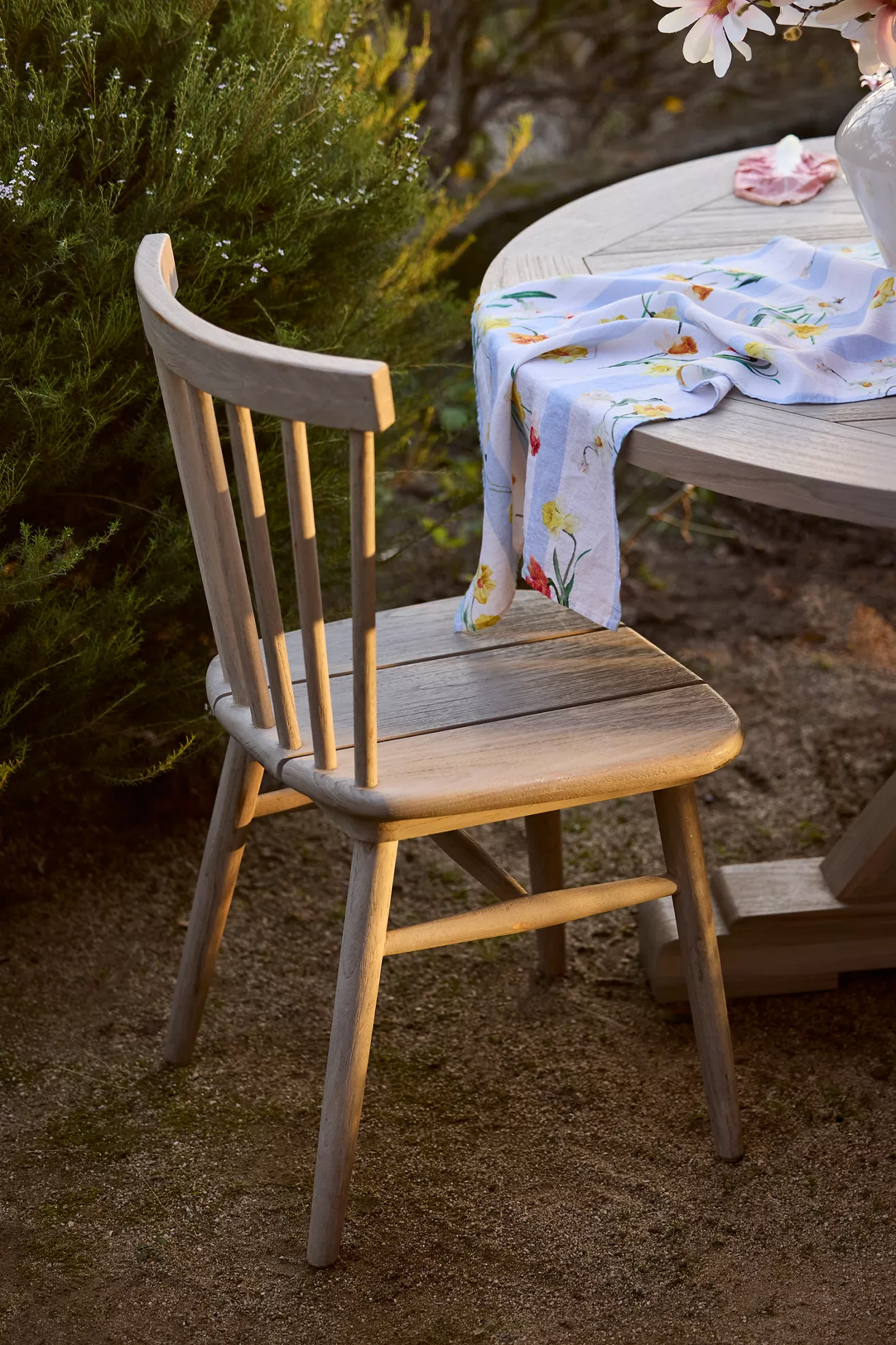 Light gray wood side chair with vertical slat back and curved armrests