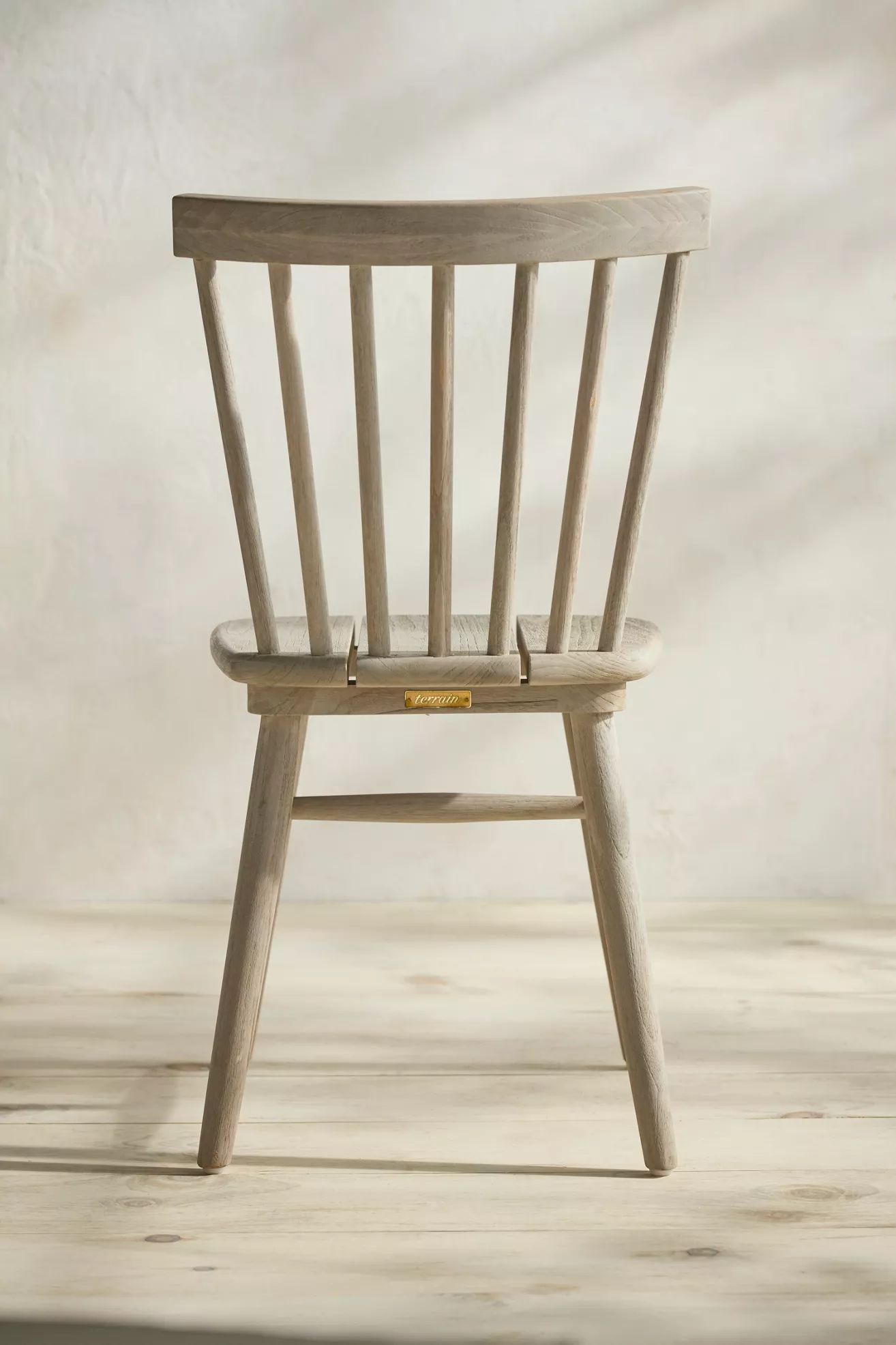 Light gray wood side chair with vertical slat back and rounded seat