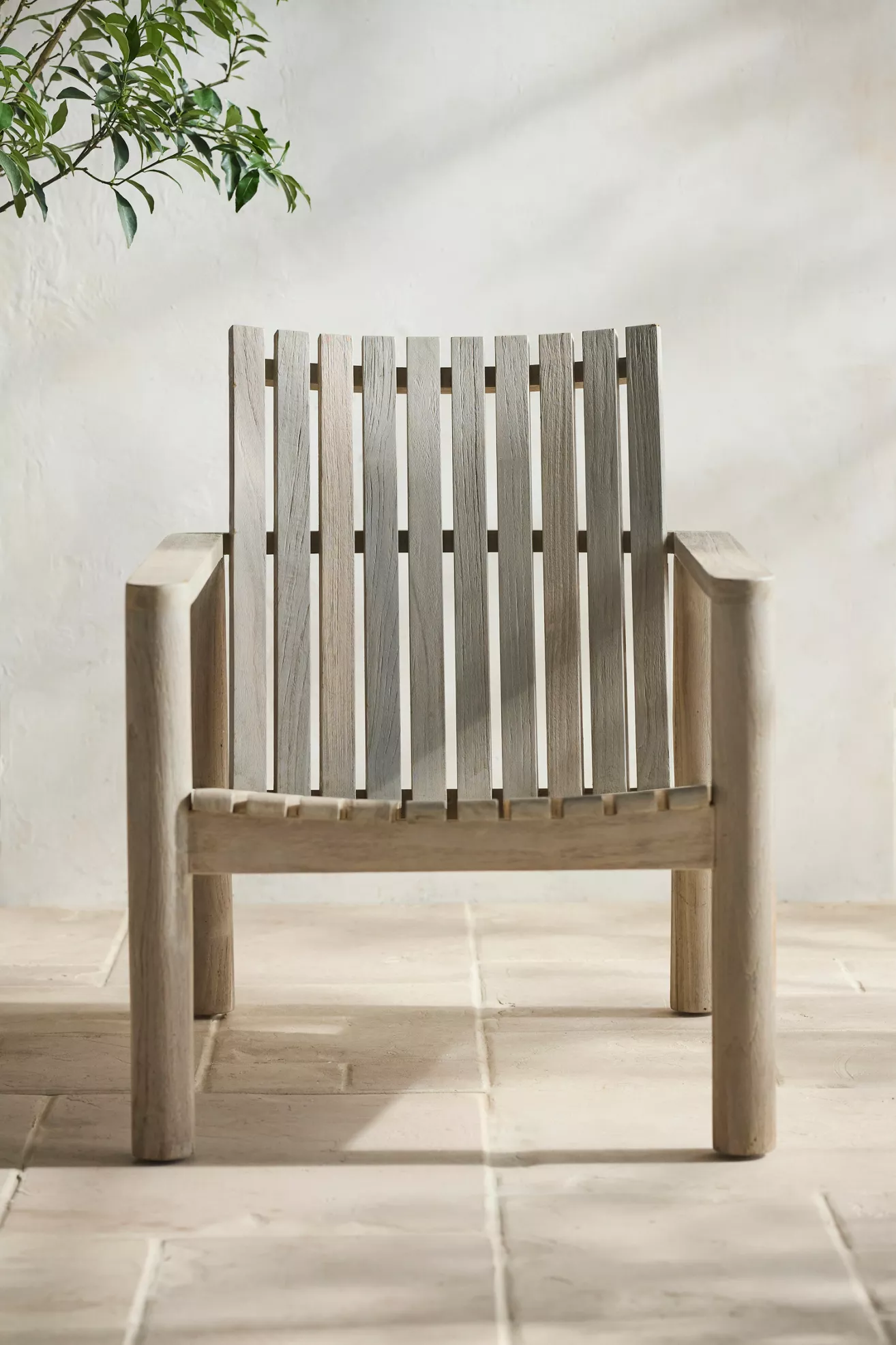 Front view of teak chair with slatted back