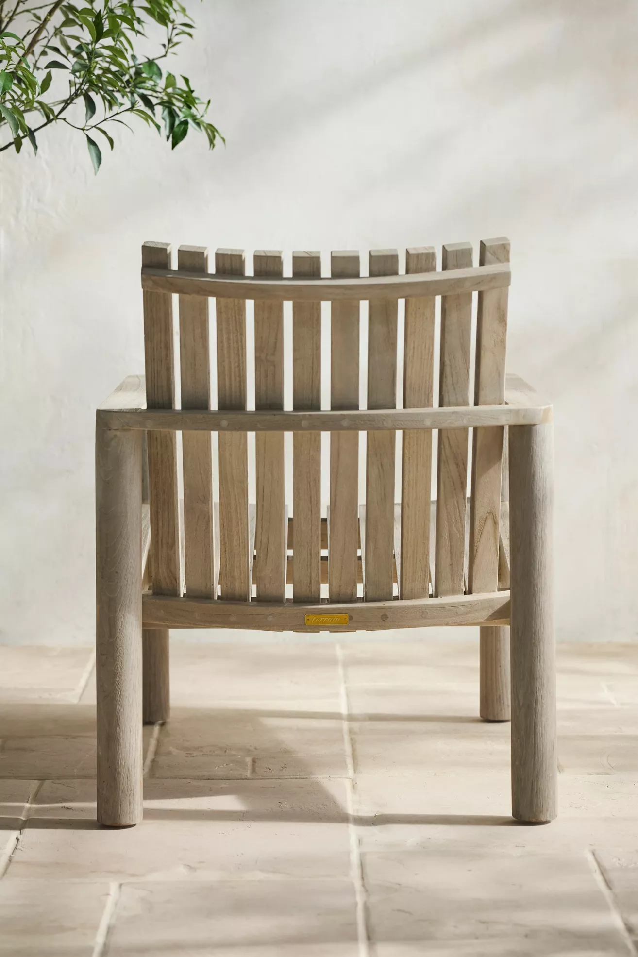 Back view of teak chair showing gap between slats