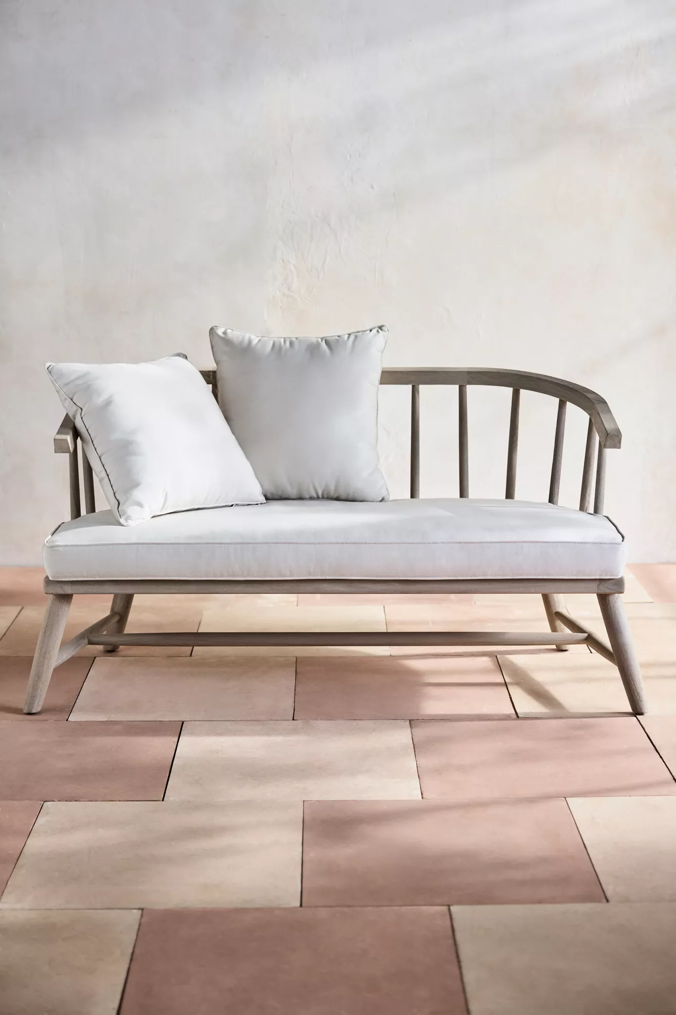 Teak outdoor two-seat sofa with two back cushions
