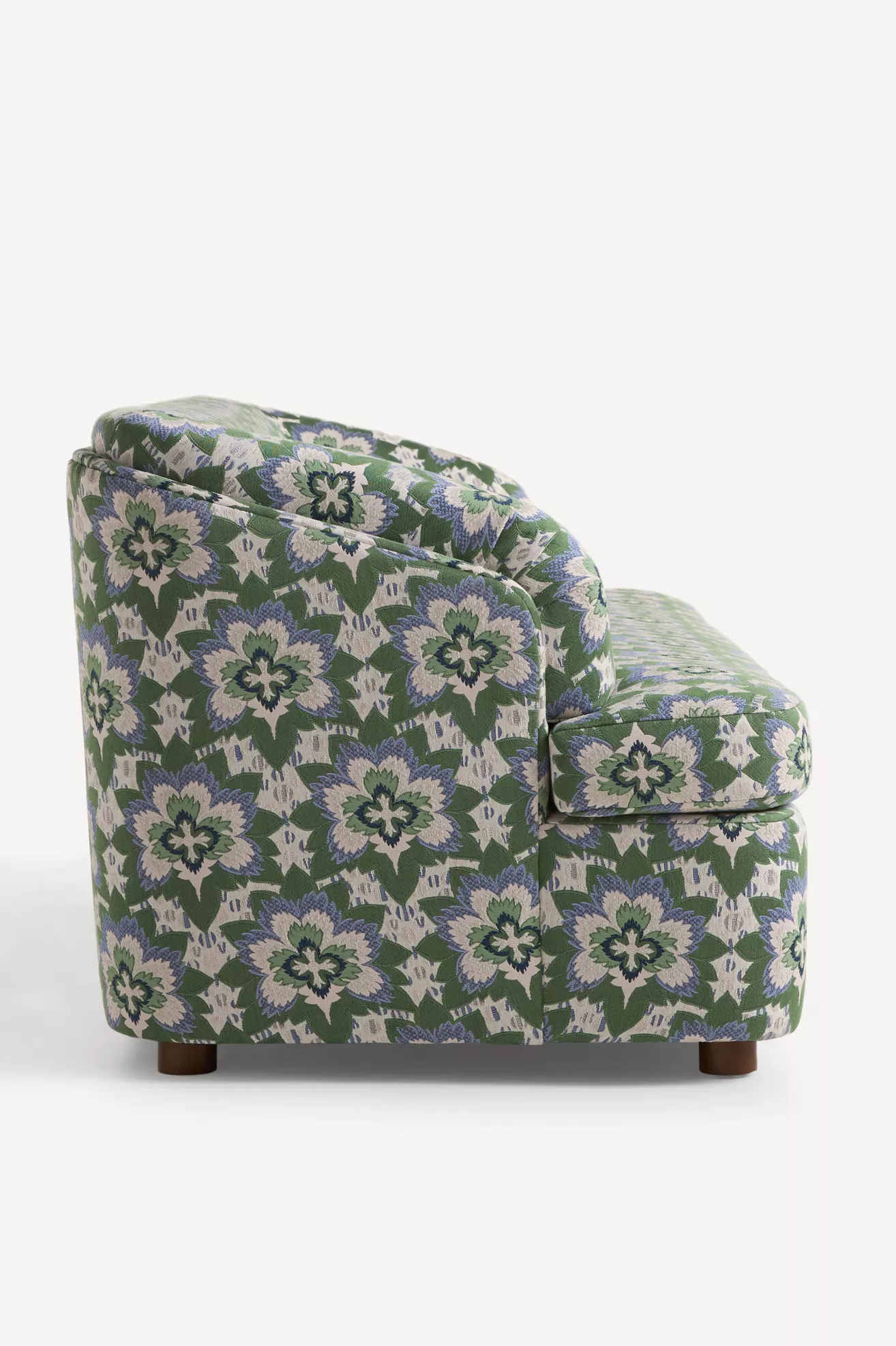Side view of green patterned sleeper sofa