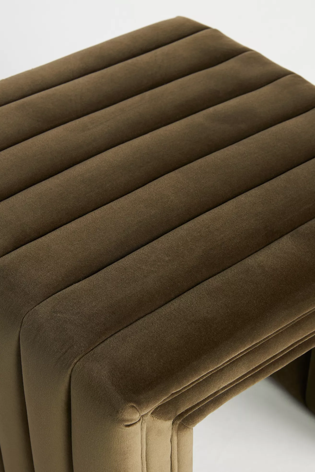 Close-up of quilted/stitched velvet upholstery with channels