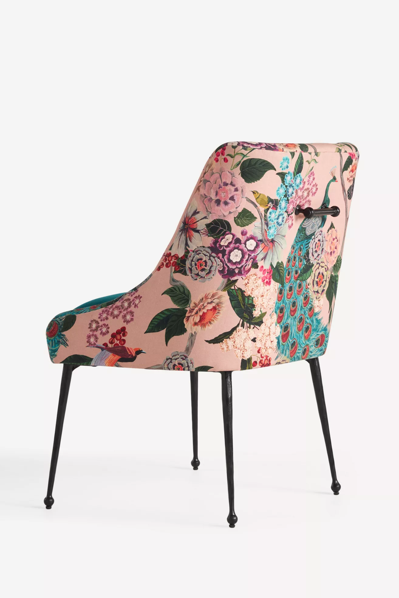 Back-right angle of floral chair showing metal back support bar