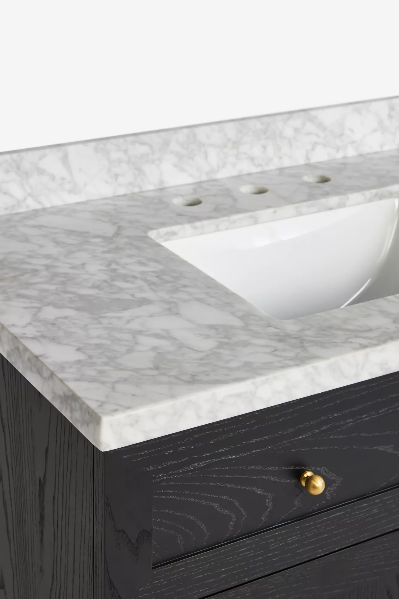Marble countertop with sink cutout and faucet holes