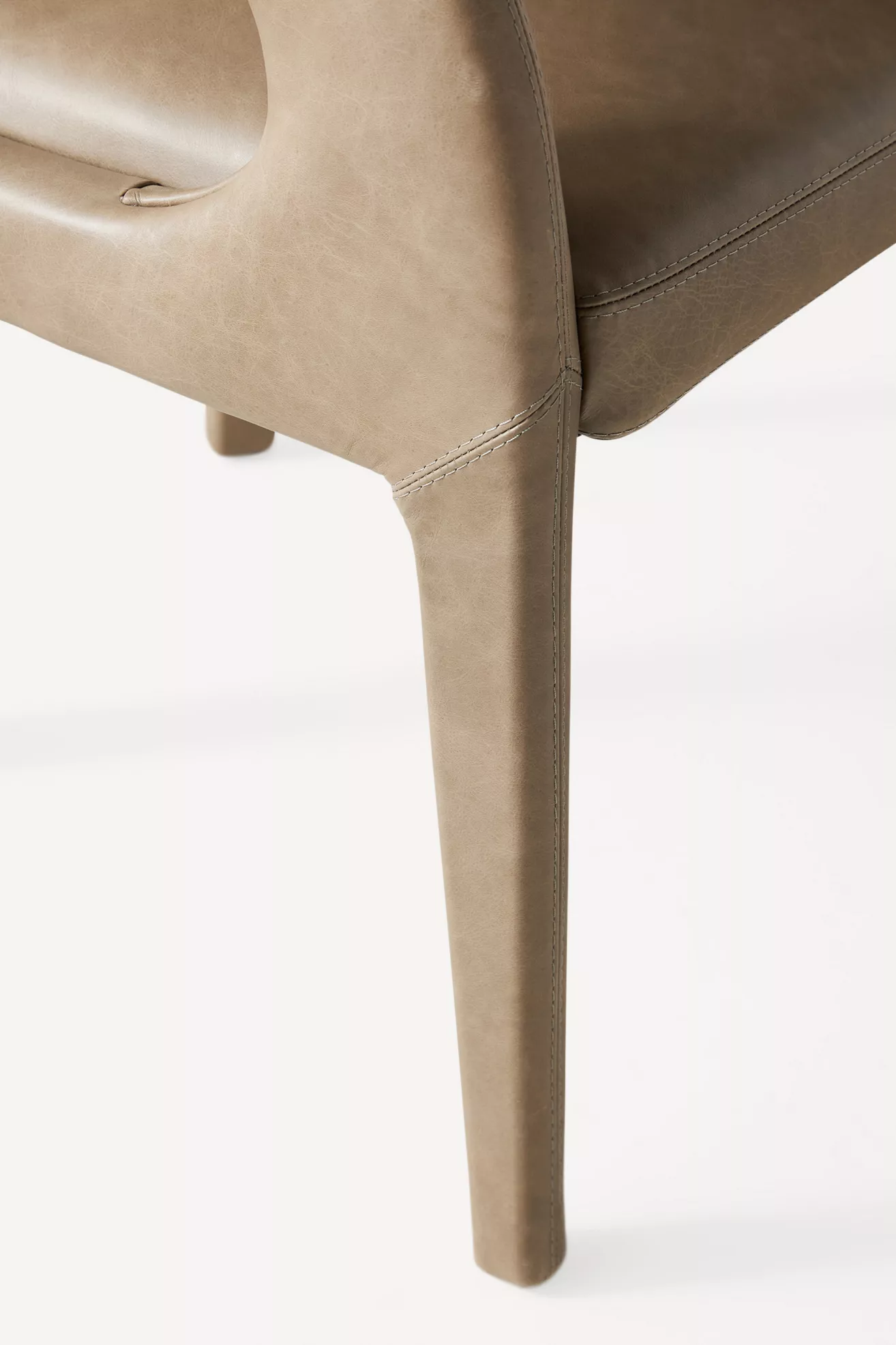 Close-up of chair leg and stitching