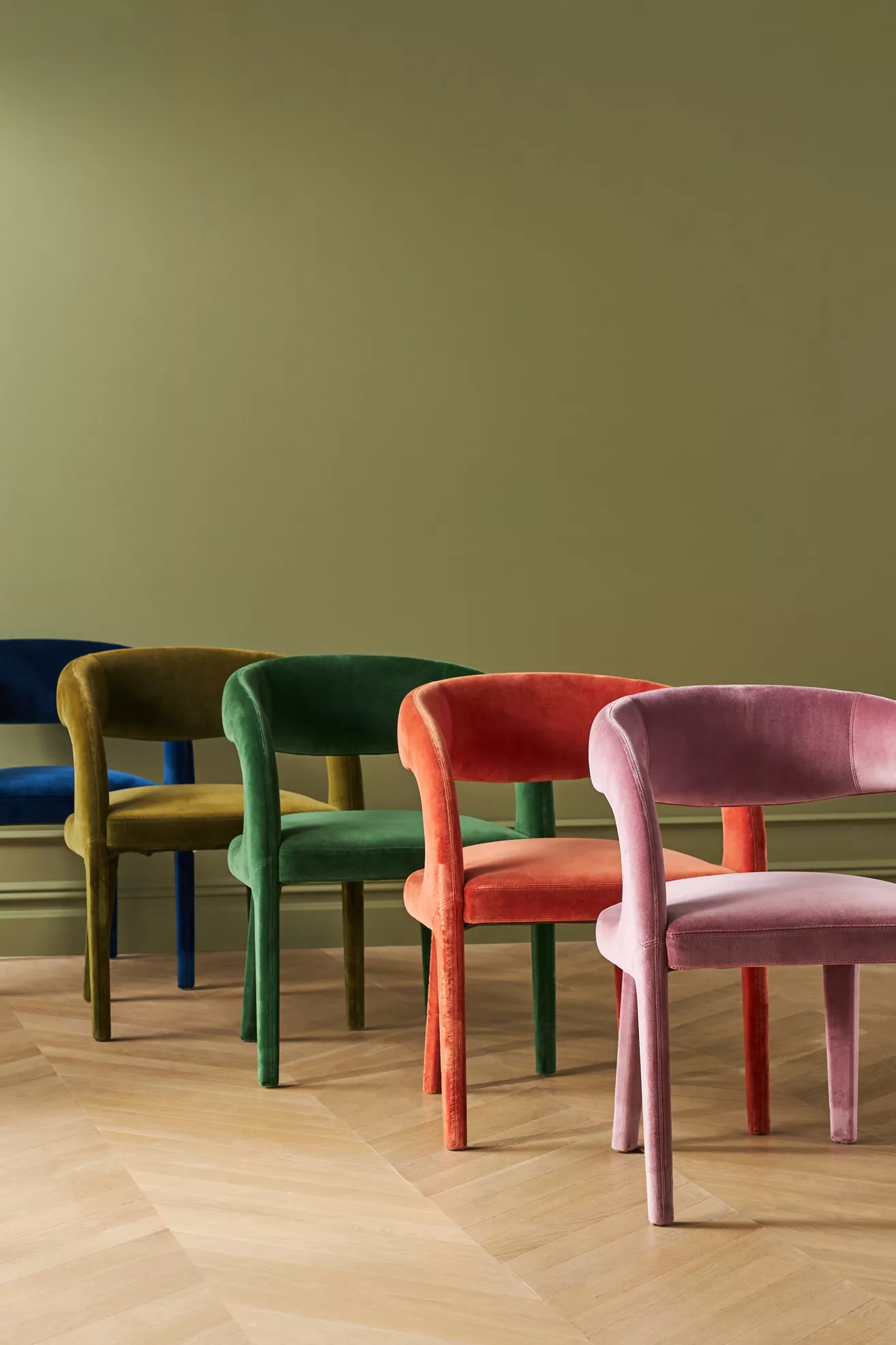 Multiple Velvet Hagen dining chairs in different colors