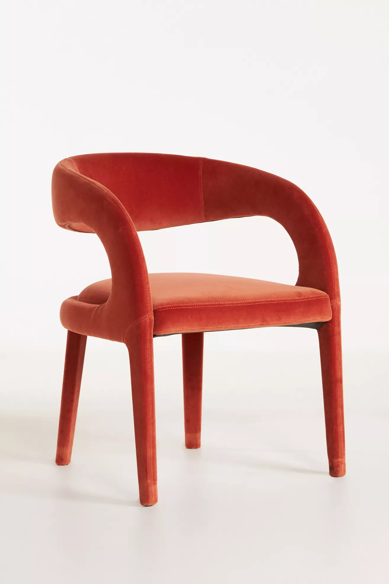 Close-up of Velvet Hagen dining chair curved back and arm