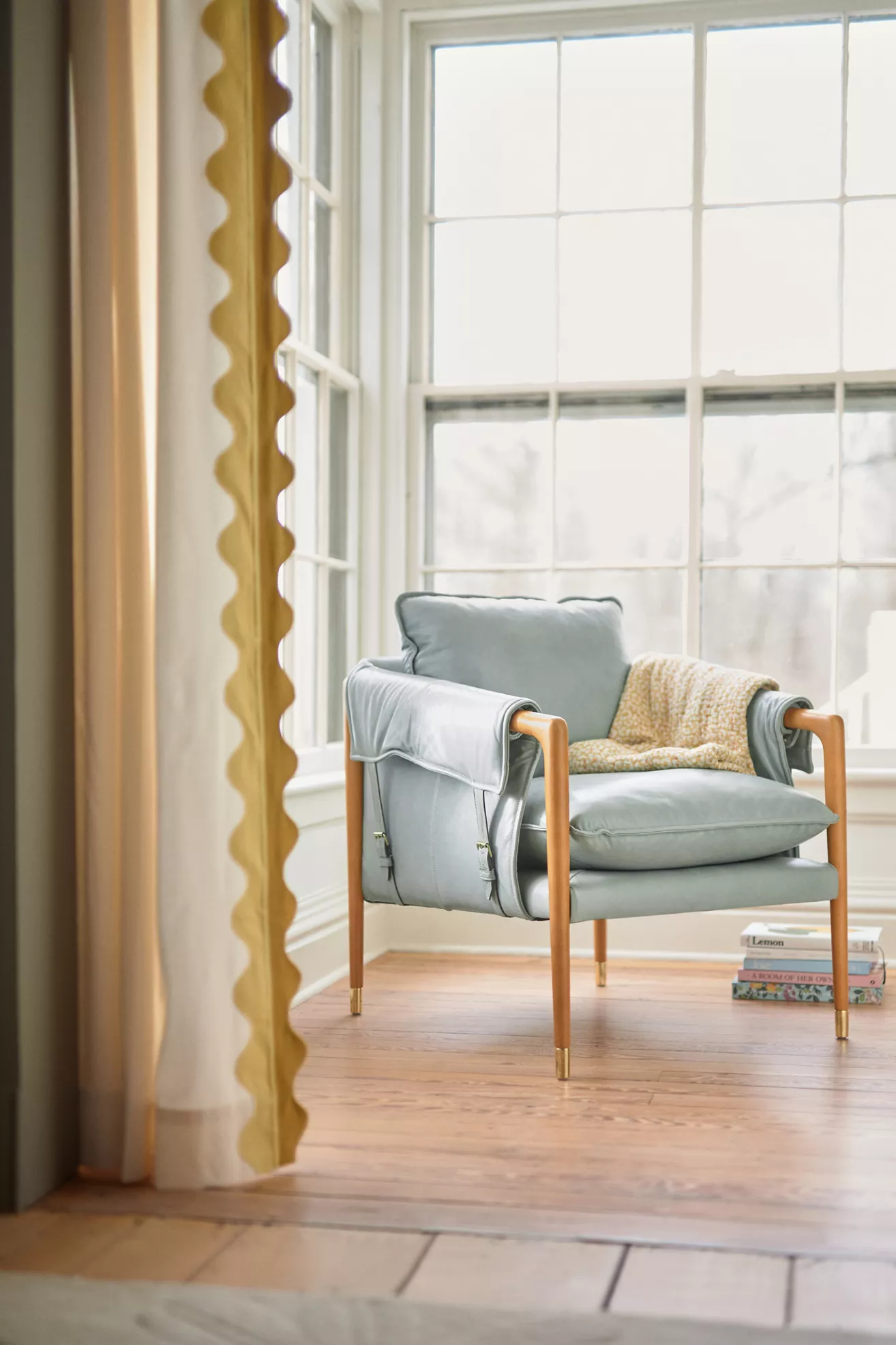 Havana leather armchair in light gray with throw pillow