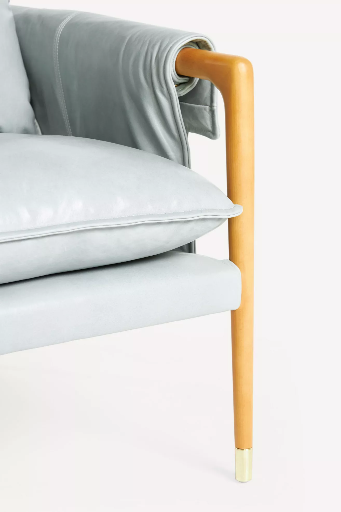 Detail of Havana leather armchair armrest and side seam