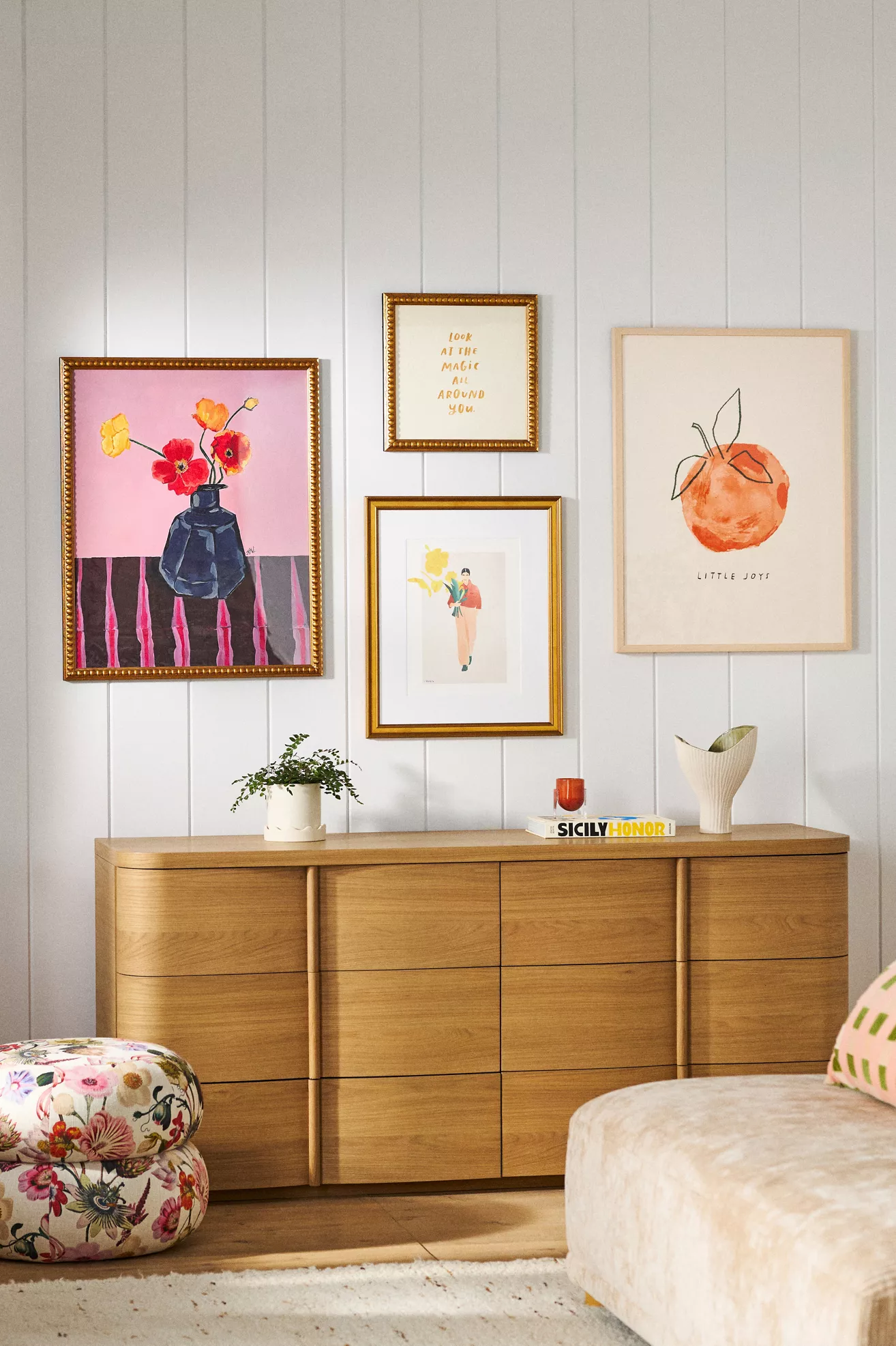 two-tone floral ottomans stacked with cat on top
