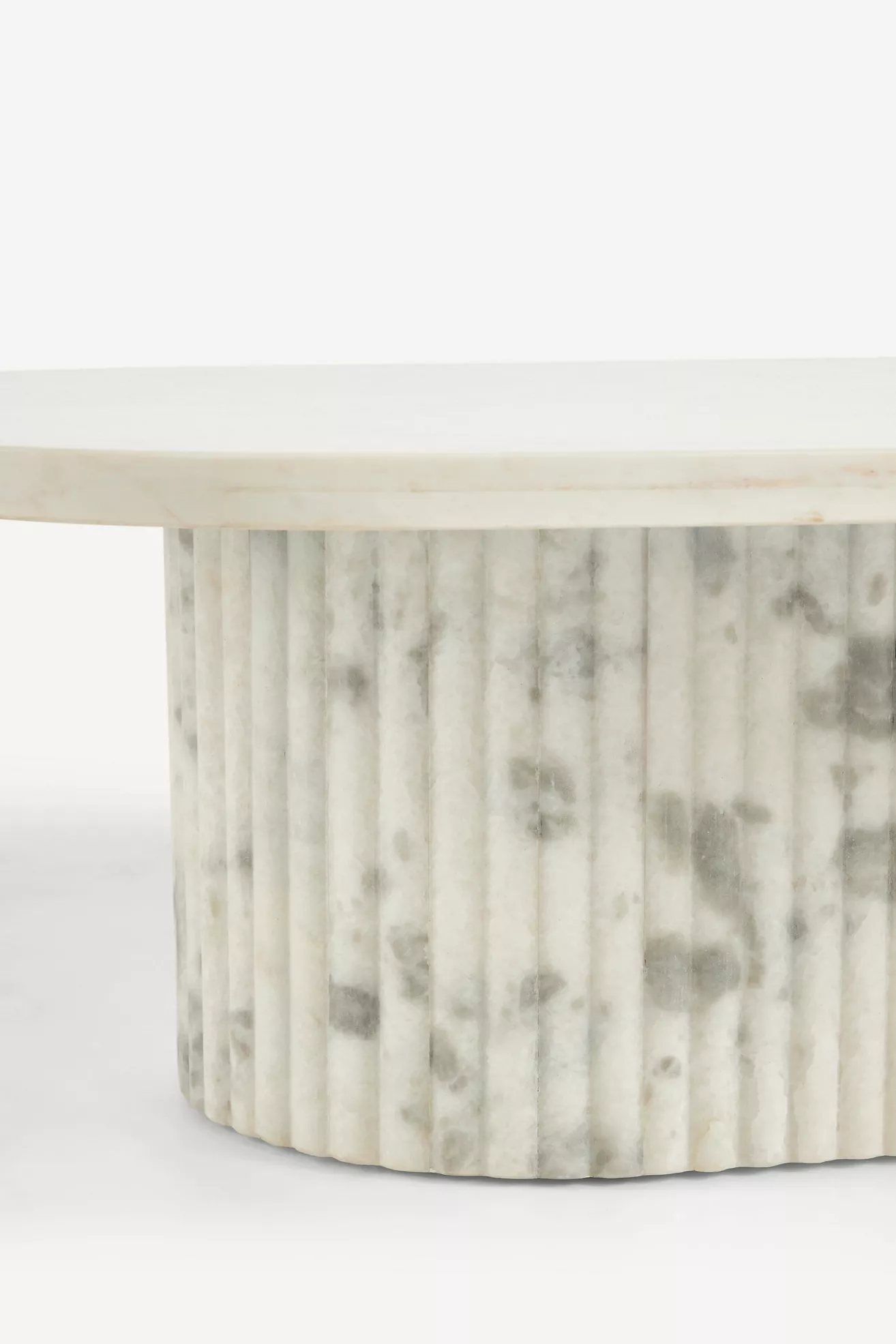 Detail of fluted marble pedestal base of coffee table
