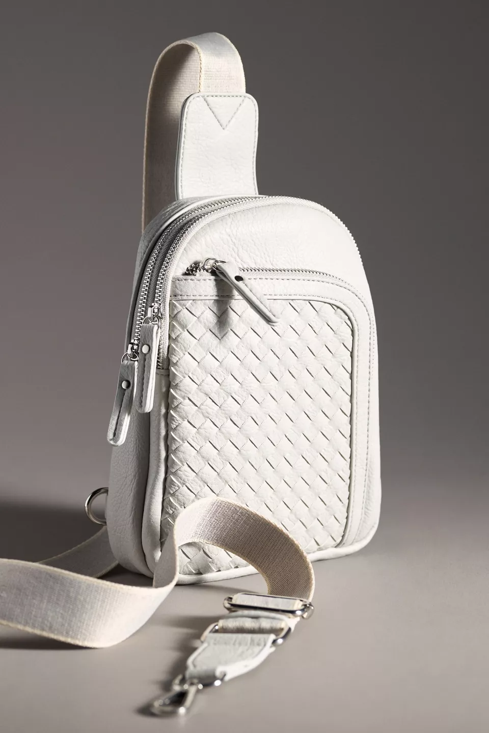 A grey sling bag