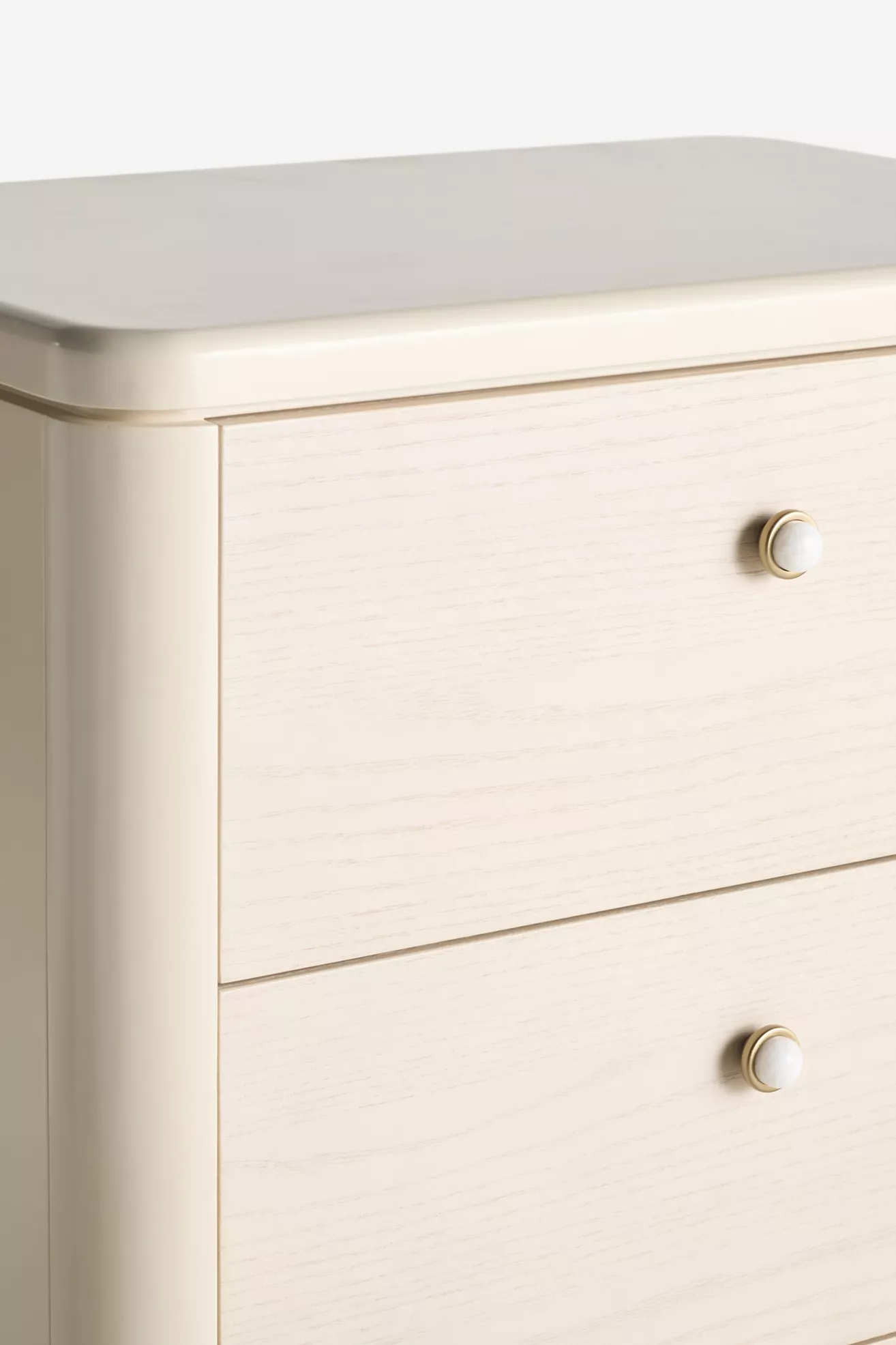 Close-up of dresser top edge and knob