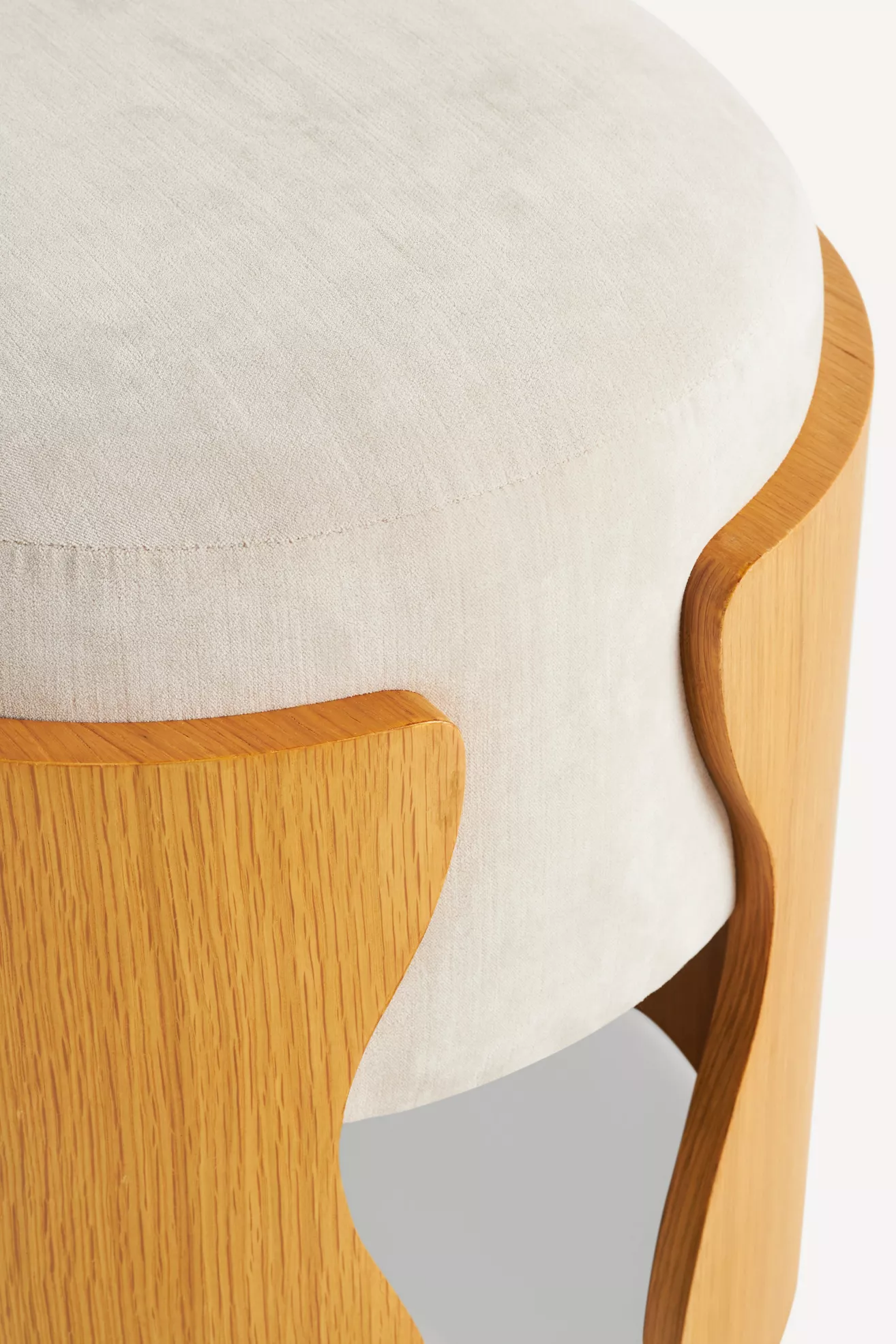 Close-up of velvet seat and wooden edge
