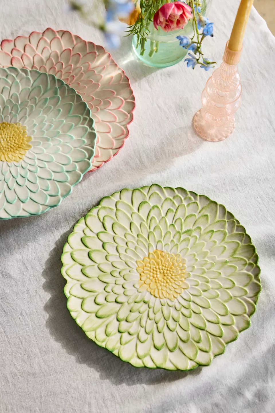 Three flower shaped dishes on a table