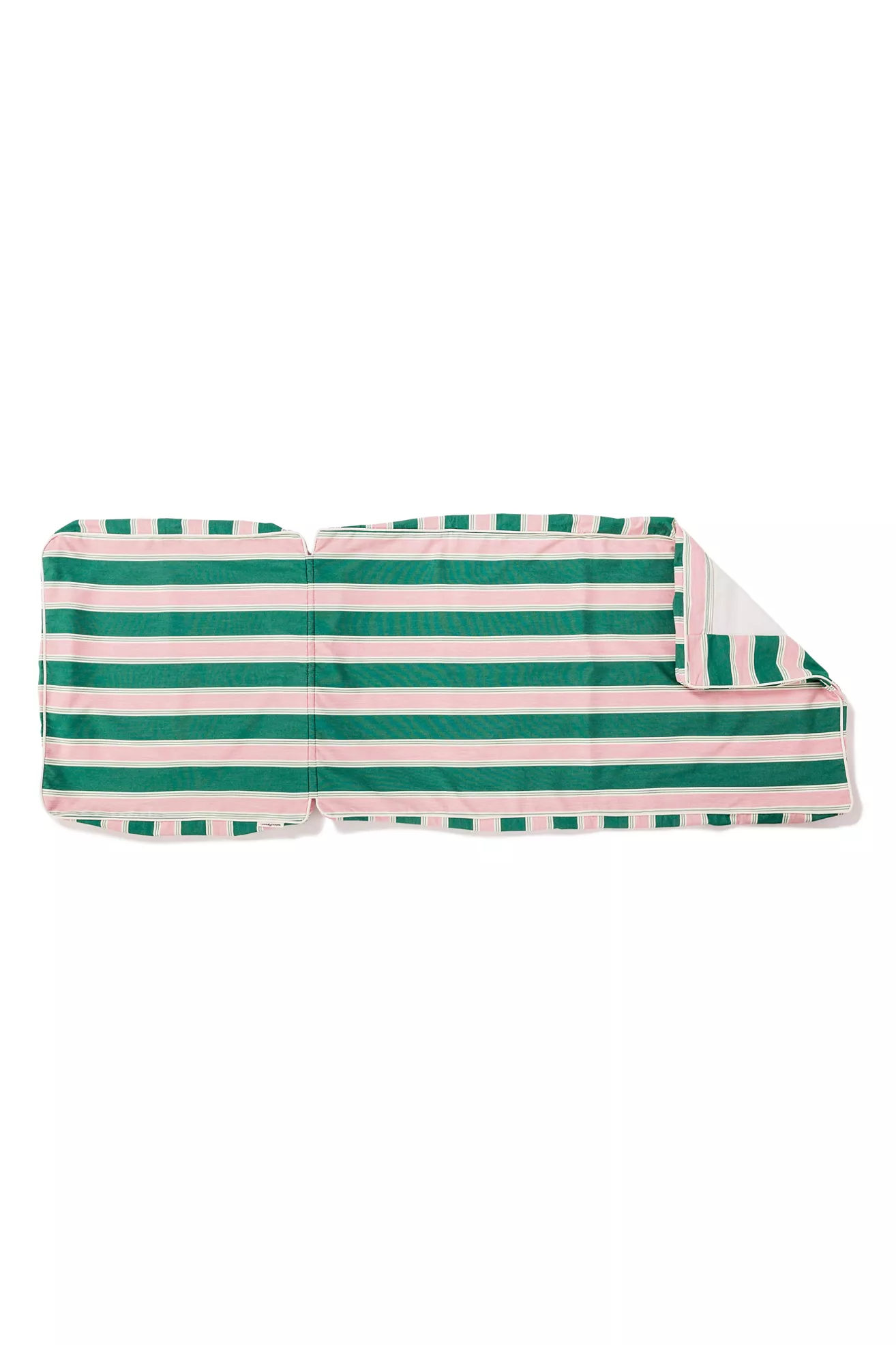 Dog wearing sunglasses lounging on striped sun lounger cushion by pool