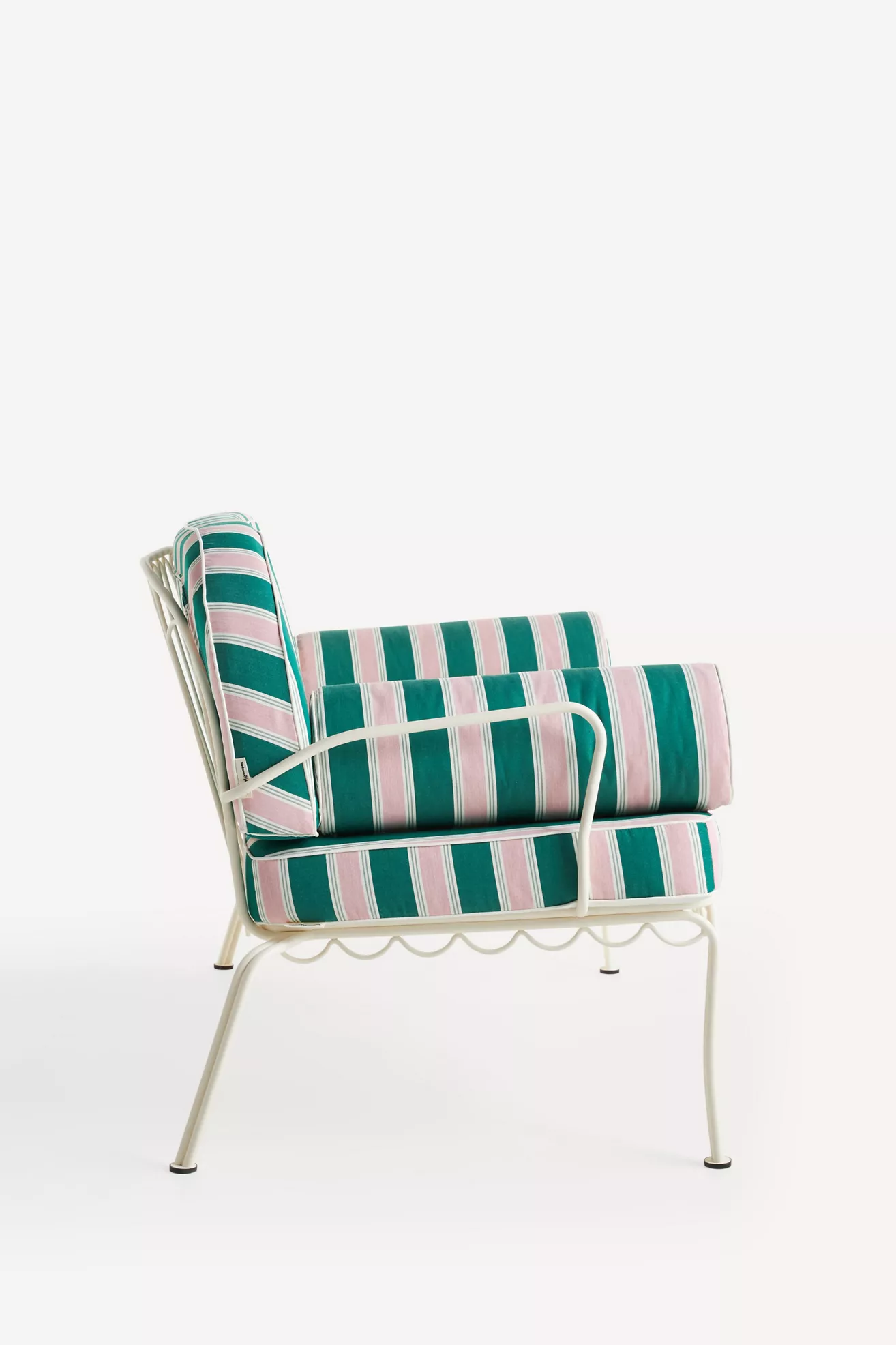 side view of striped outdoor loveseat with matching cushions