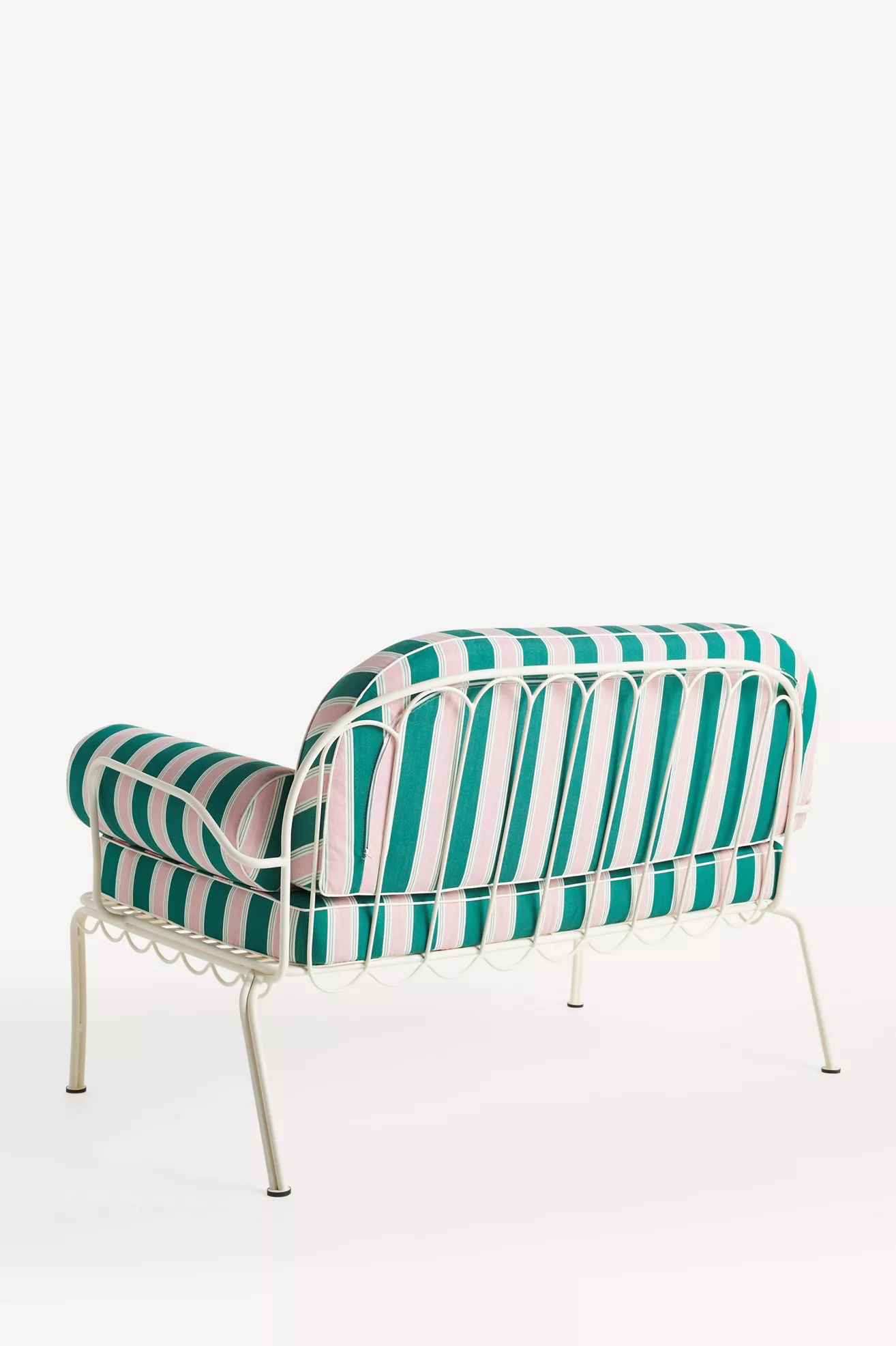 three-quarter view of striped loveseats with cushions
