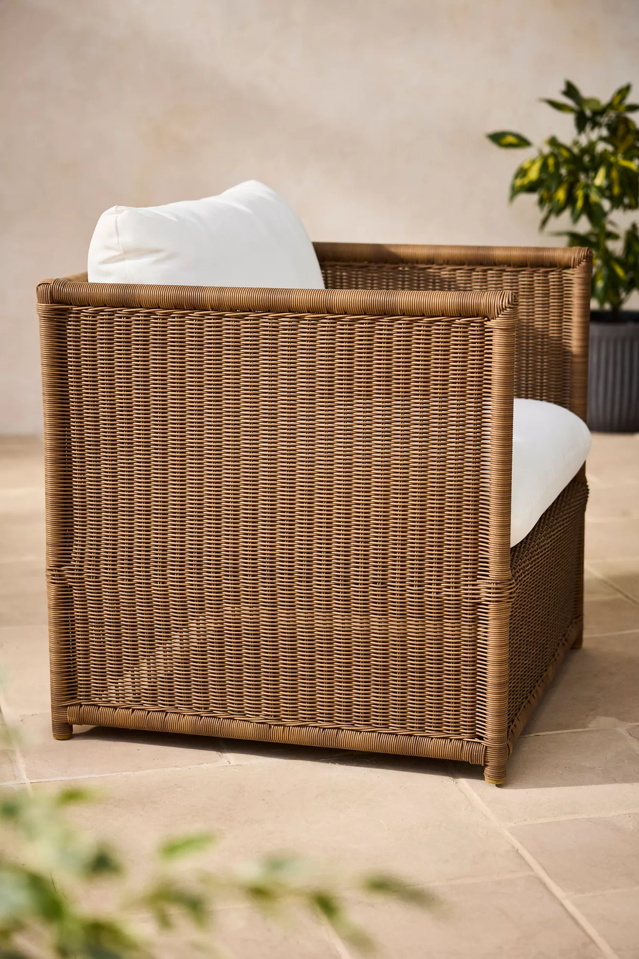Rear view of wicker lounge chair showing full woven back