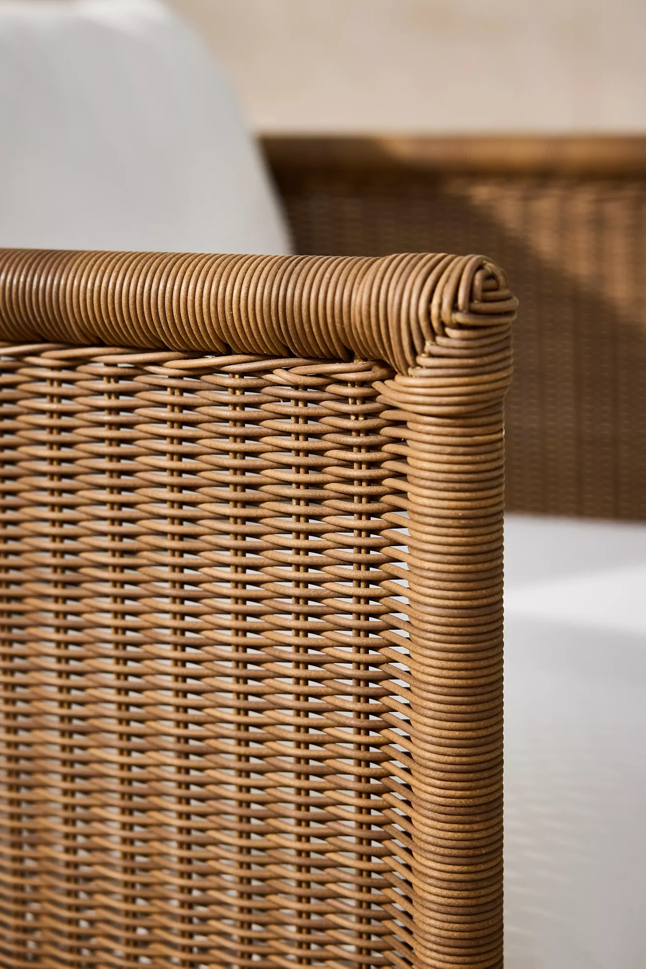 Close-up of wicker weaving on arm of chair