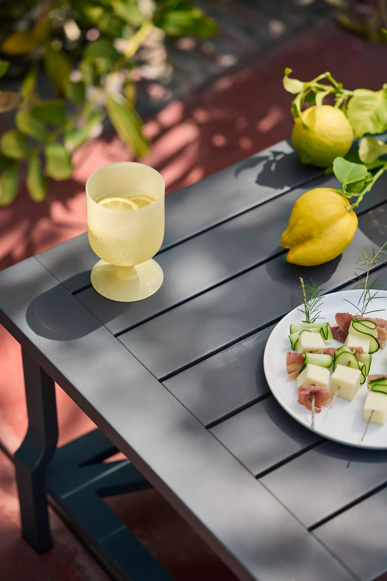 Close-up of table surface with lemon and plate