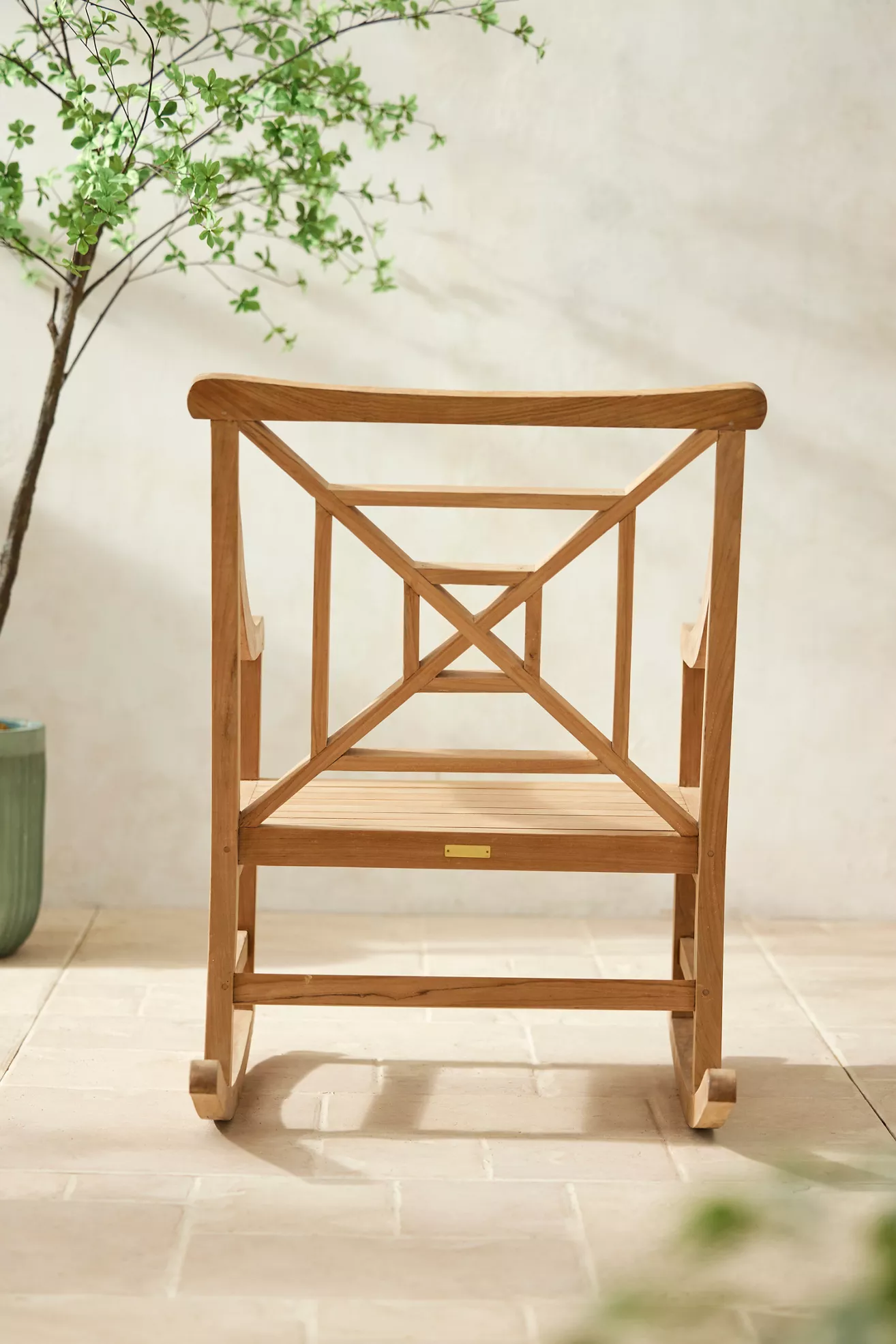 Back view of teak fretwork rocking chair